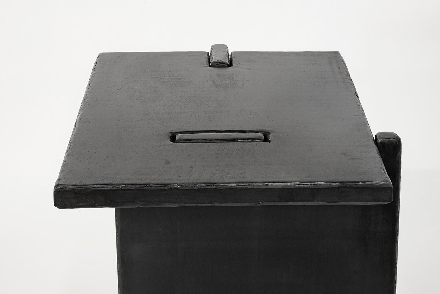 Table No. 5
J.M. Szymanski
d. 2022

This side table is composed of stark, perpendicular planes that have been notched and precisely slotted together. Its hand-carved rough edges contrast beautifully with the continuous flat surfaces that make up its