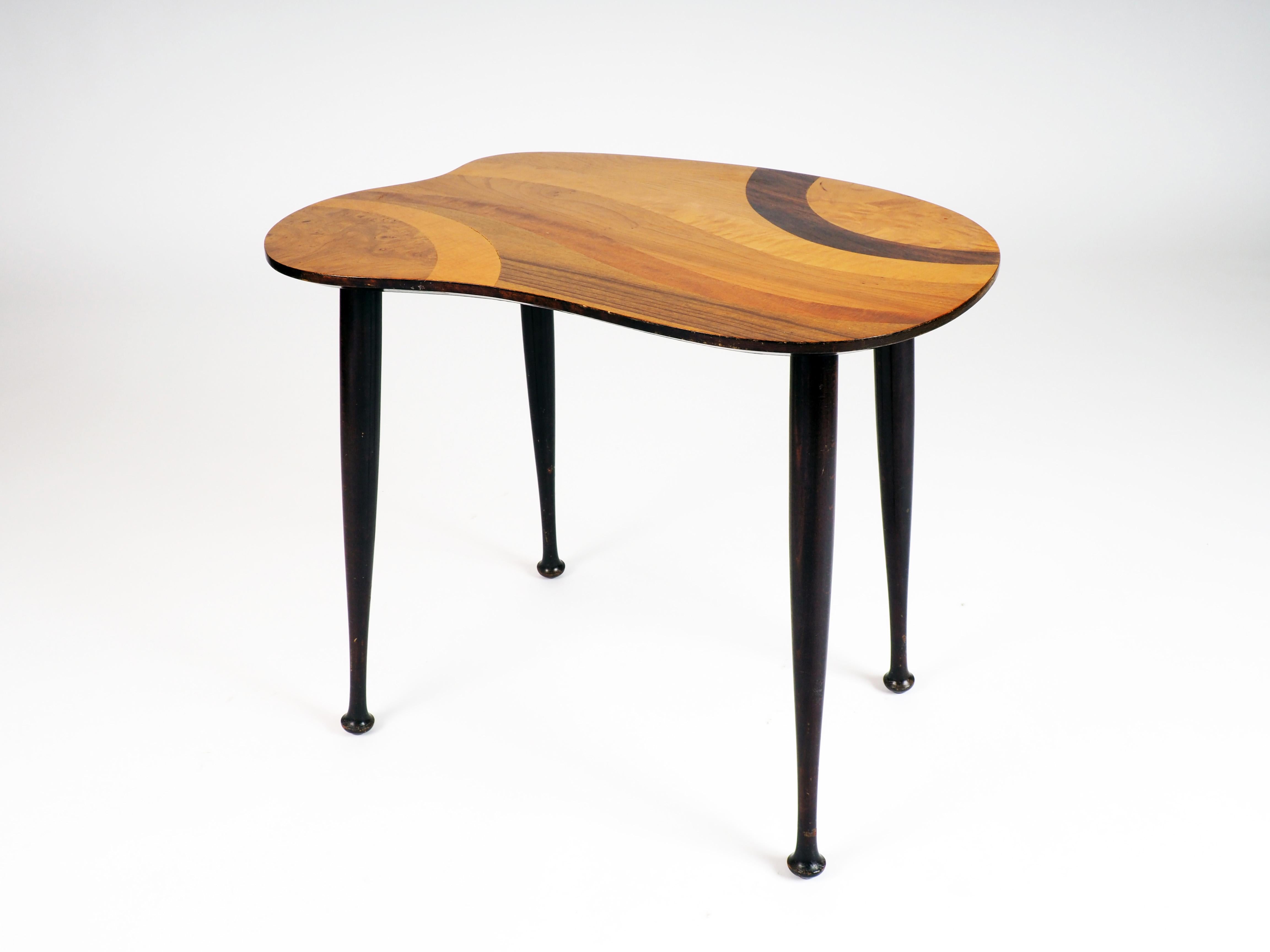 Side table with inlaid wood top. Made in Sweden during the 1950s.
