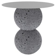 Side table with stainless steel and volcanic stone