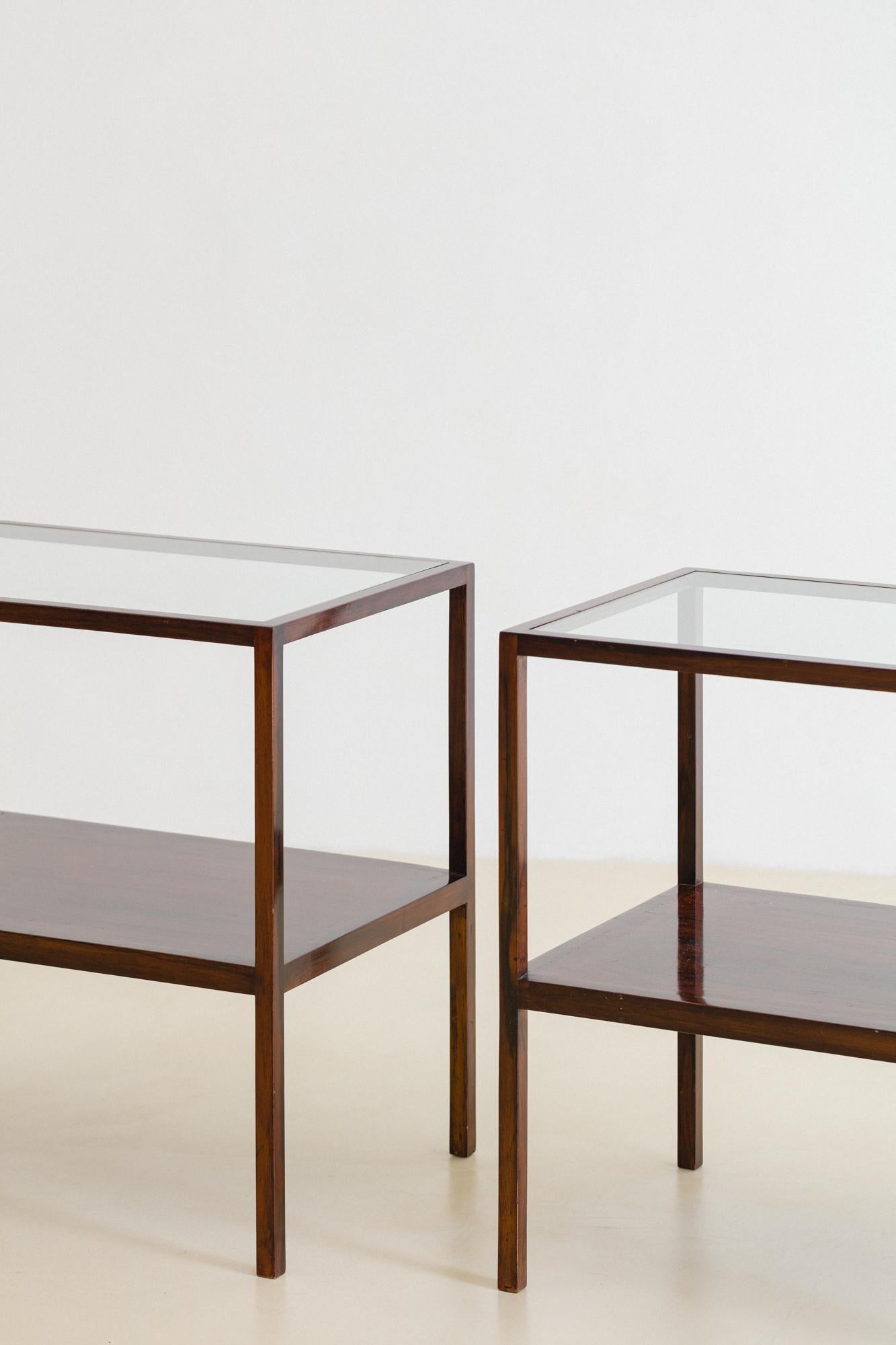 This gorgeous pair of Side Tables was designed by Joaquim Tenreiro (1906-1992) and produced in the 1960s. The pieces are made in solid Rosewood ans present two tops: one in Rosewood and the other in glass.

This is the perfect choice to complete