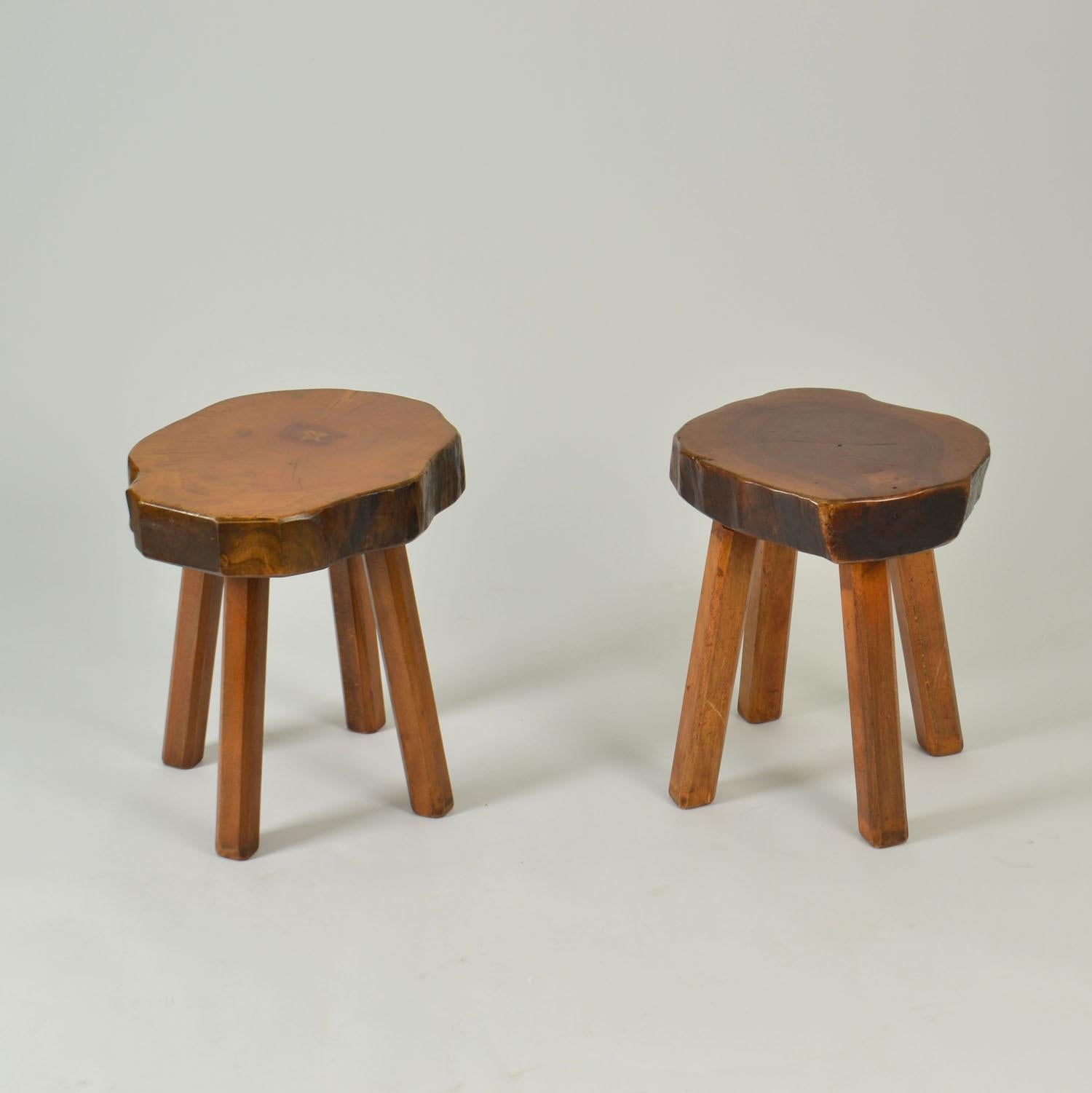 Pair of handcrafted side tables in Burr Elm wood 1970's. These stools have been handmade individually, therefore each stool is unique with a freeform shape seat using the natural contours of the wood. The voluptuous four legged tabless have a rustic