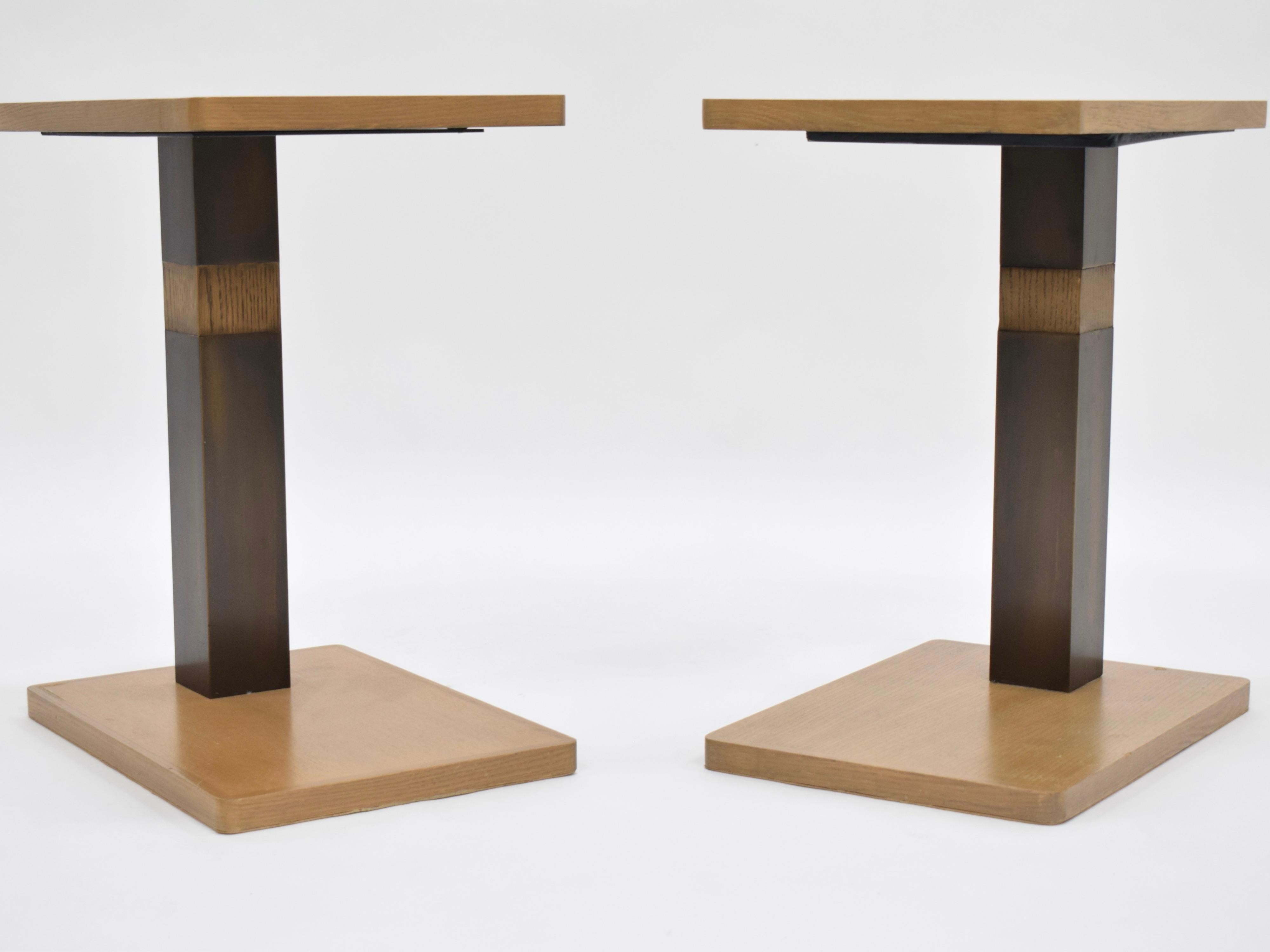 A pair of cerused oak side tables in the style of Paul Dupre-Lafon. These tables boast Dupre-Lafon's iconic style that blended the simplicity of modernism with the luxury of art deco design. 