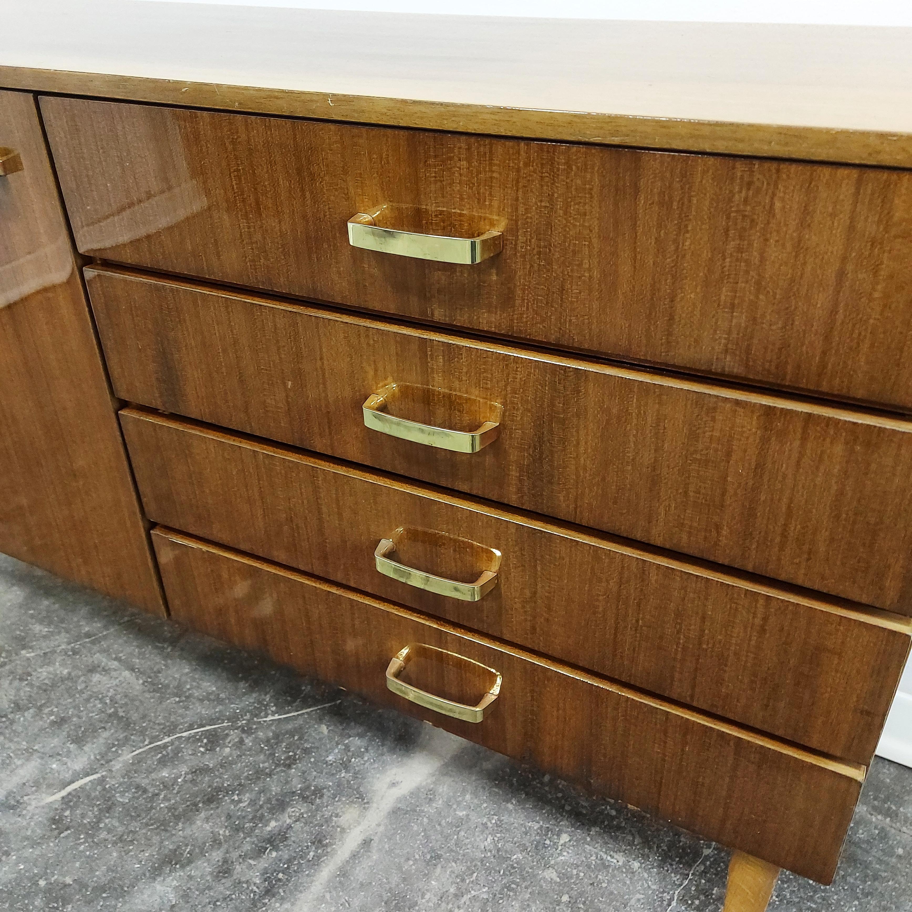 Sideboard 1960s

Produced by MEBLO as a set called Alenka.

Nicely preserved and in great condition with a few scratches.

All main parts from hardwood.