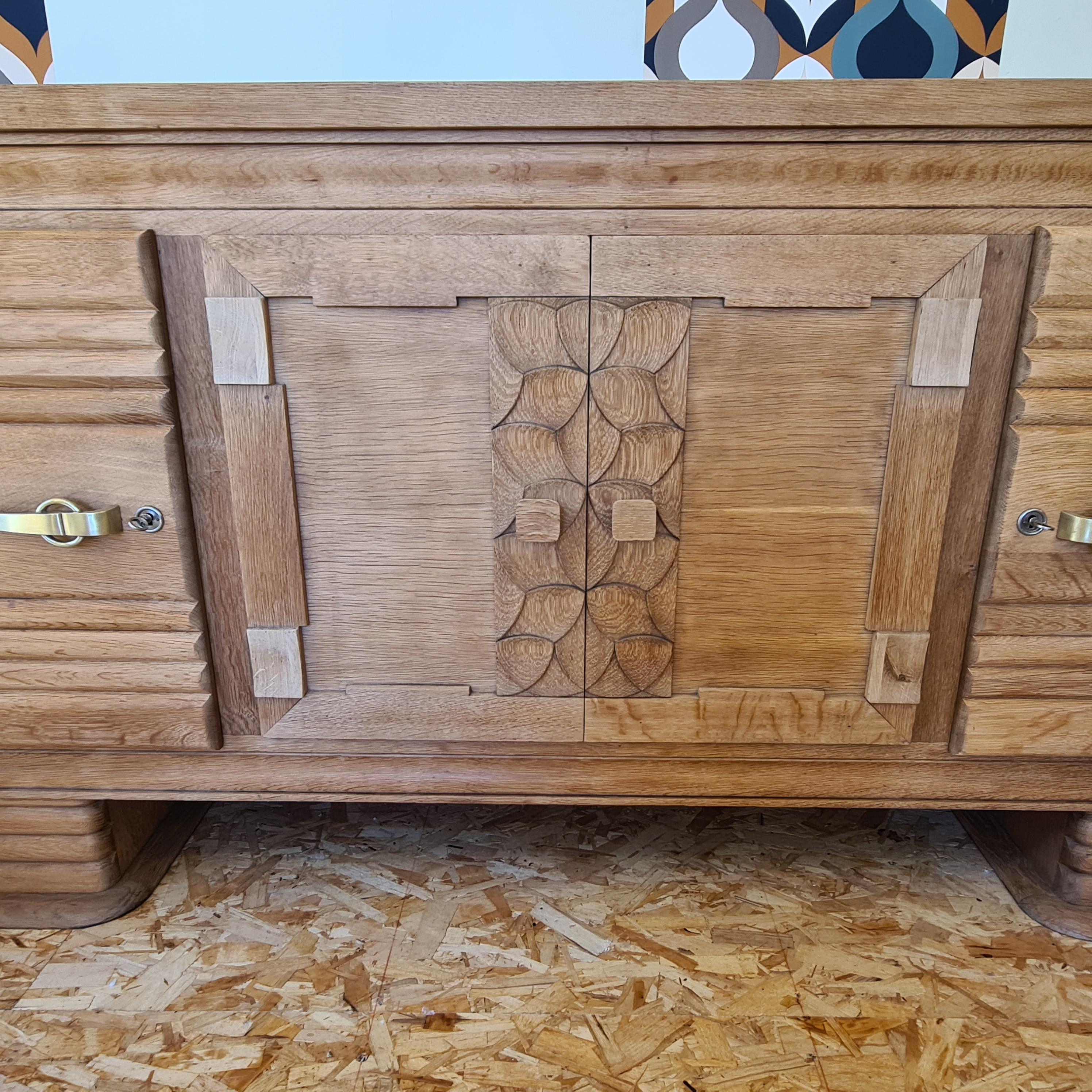 Sideboard 4 doors in solid oak  manner of Charles Dudouyt  In Good Condition For Sale In TARBES, FR
