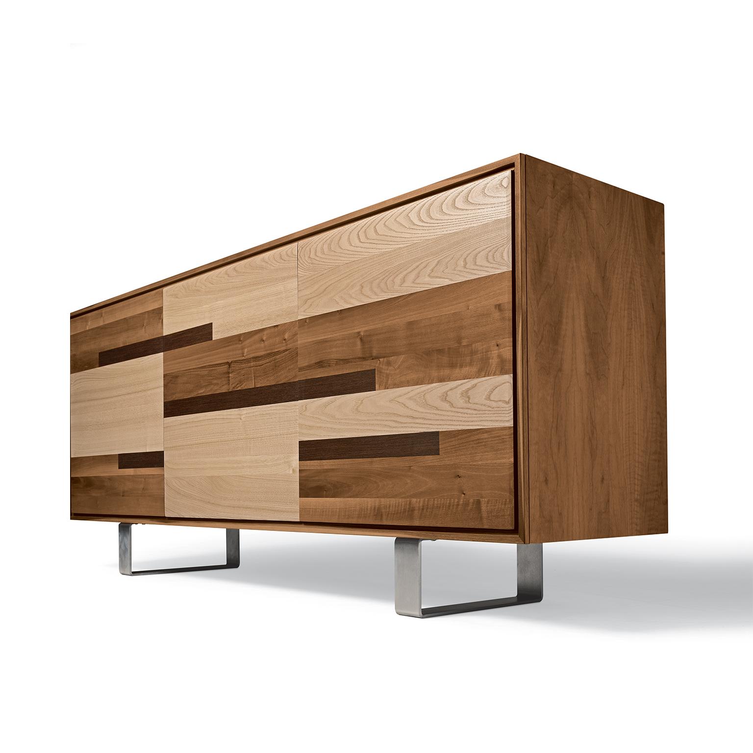 Completely designed and made in Italy, this sideboard it’s an expression of fine Italian craftsmanship. Made of fine walnut, walnut wengé, and ash it comes with three doors and with the inside composed of transparent glass shelves. Since it’s