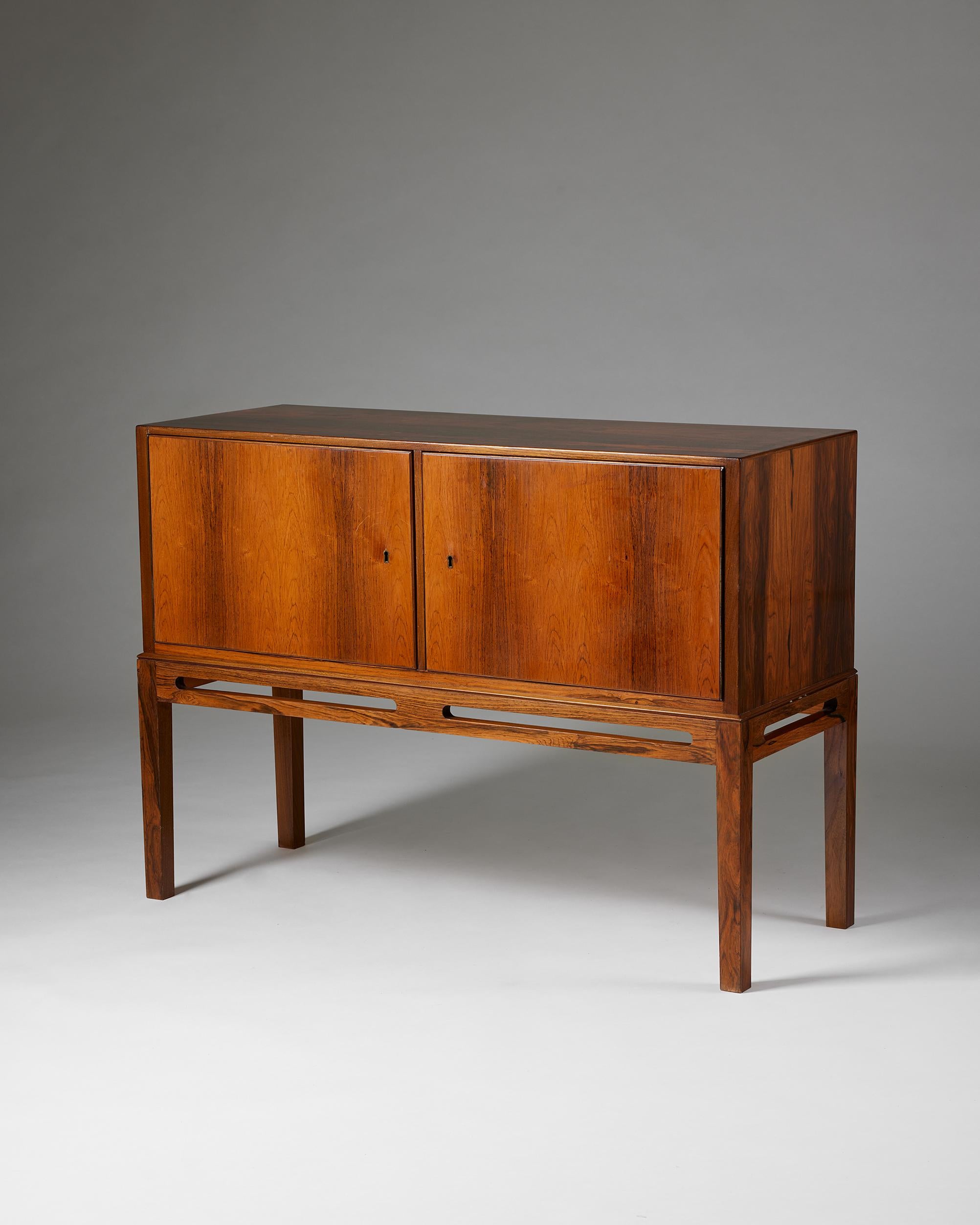 Sideboard, anonymous, for Heltborg Möbler,
Denmark, 1960s.

Rosewood.

Stamped.

Dimensions: 
H: 80.5 cm / 2' 7 3/4''
W: 110.5 cm / 3' 7 1/2''
D: 42 cm / 16 1/2''