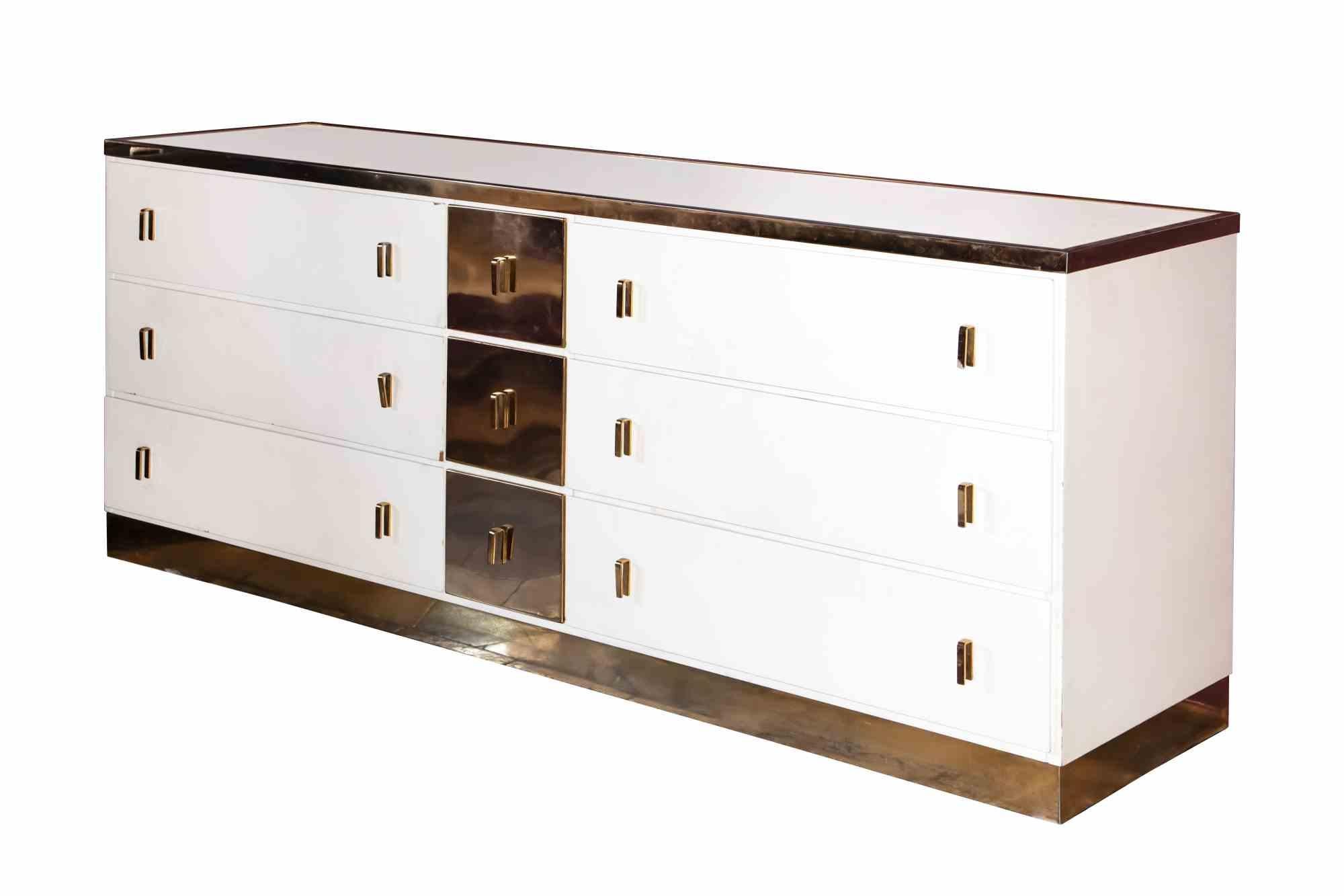 Sideboard Bagdad is an original contemporary Artwork realized in Italy in the 1970s by Luciano Frigerio (Desio, 1928 – Sanremo, 1999).

Lacquered wood and brass.

Made in Italy.

Created for Mobili nella Valle.

Total dimensions: 76.5 cm x