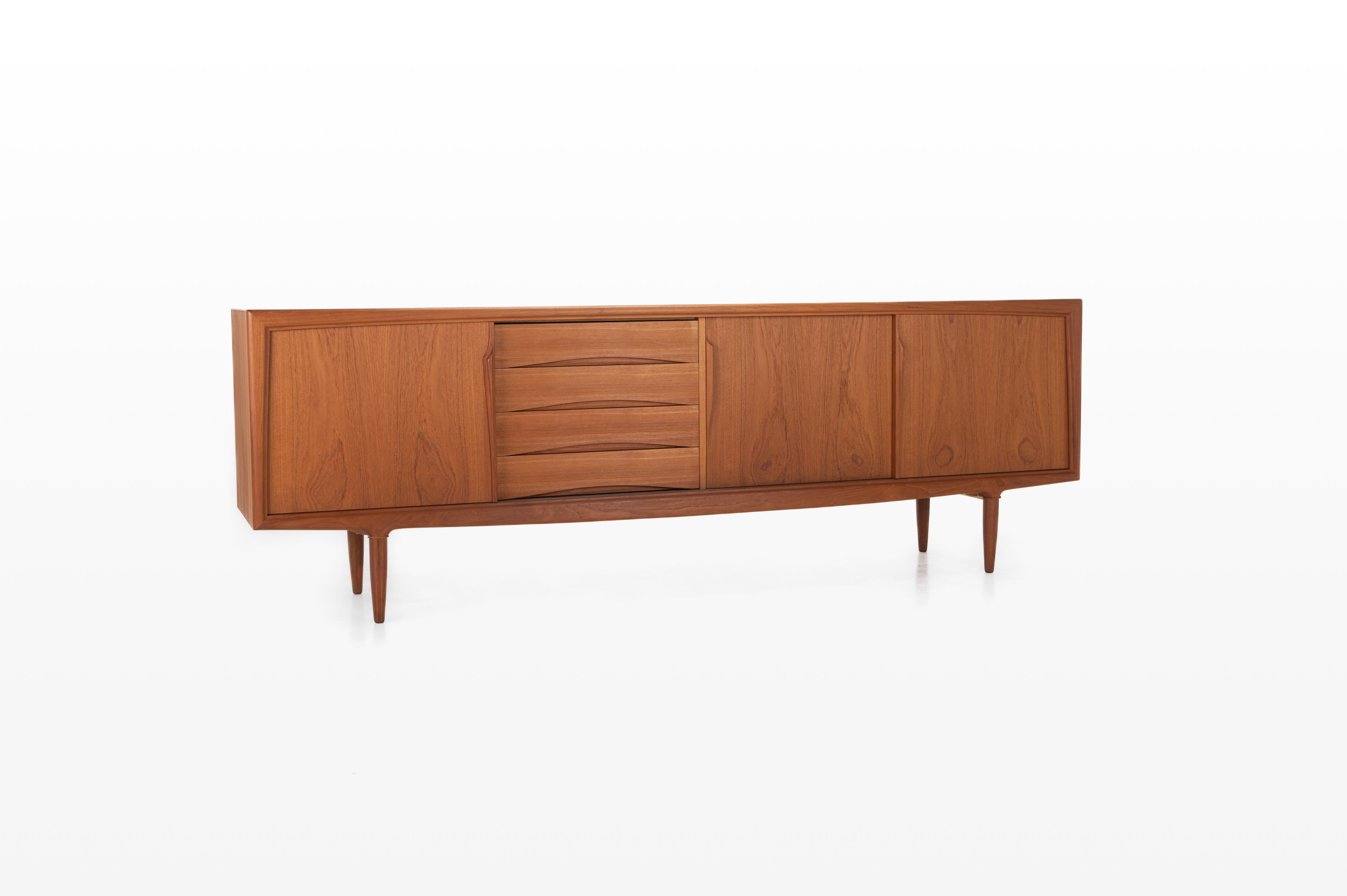Produced by Axel Christensen Odder (ACO Møbler) and designed in the 1960s. Beautifully designed sideboard with elegant handles, four drawers and plenty of storage space with adjustable shelves.