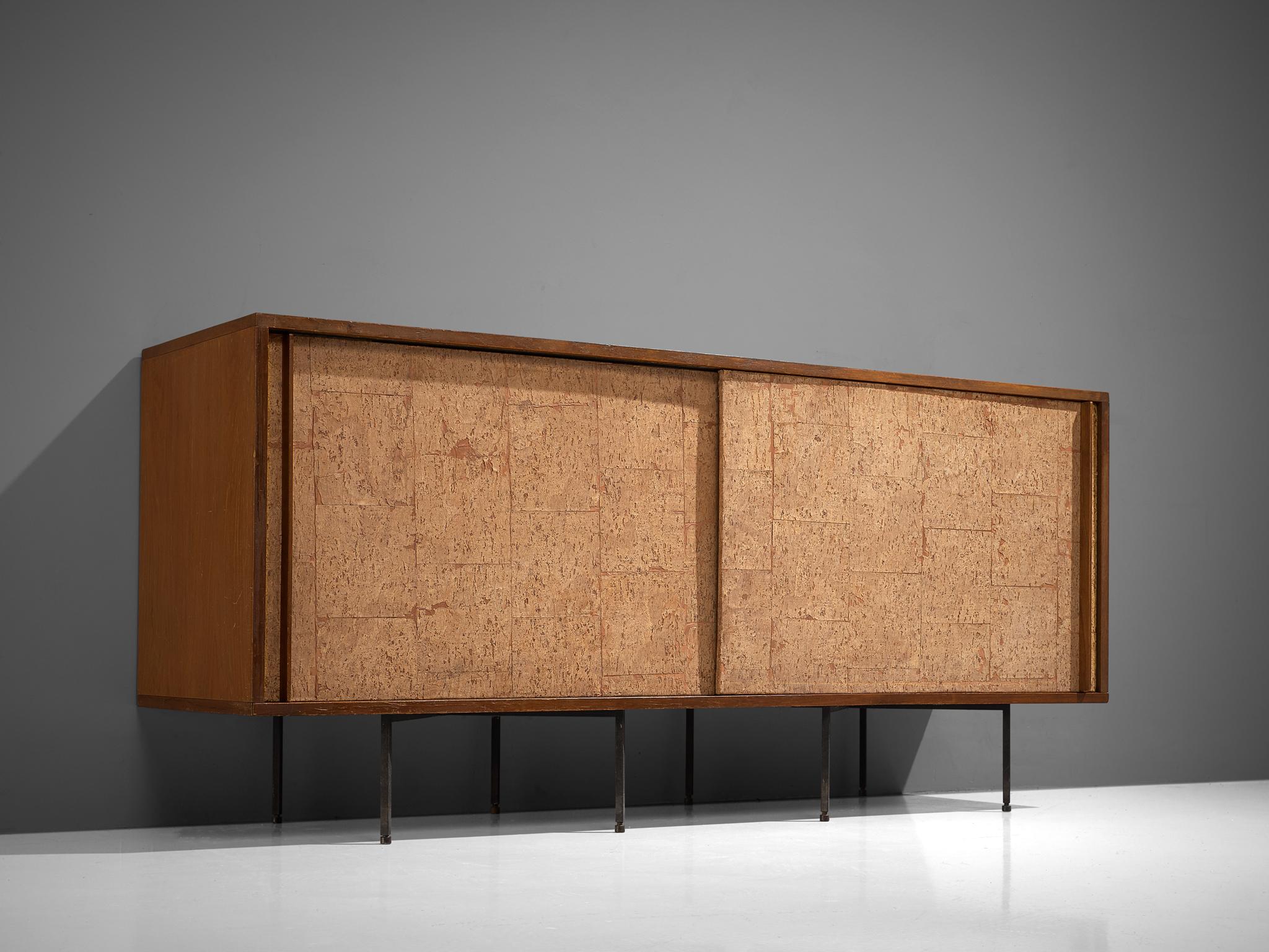 Campo & Graffi, sideboard, wood, cork and metal, Italy, 1960s

This small credenza is executed with two sliding doors executed in cork with wooden handles that run all the way from the top to the bottom of the doors. The credenza is placed on