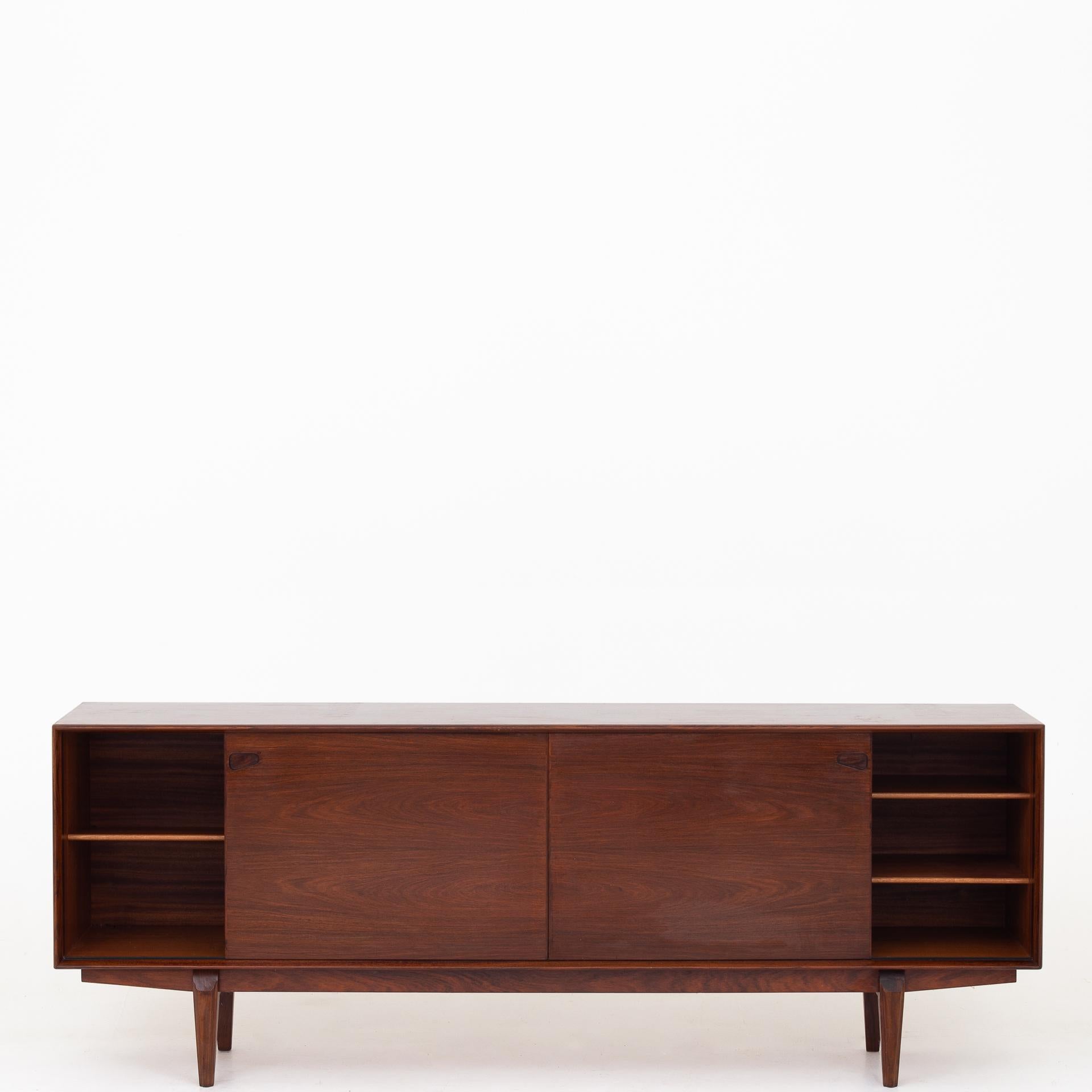 Model 65 - Sideboard in rosewood with two doors and five drawers. Maker Skovby.