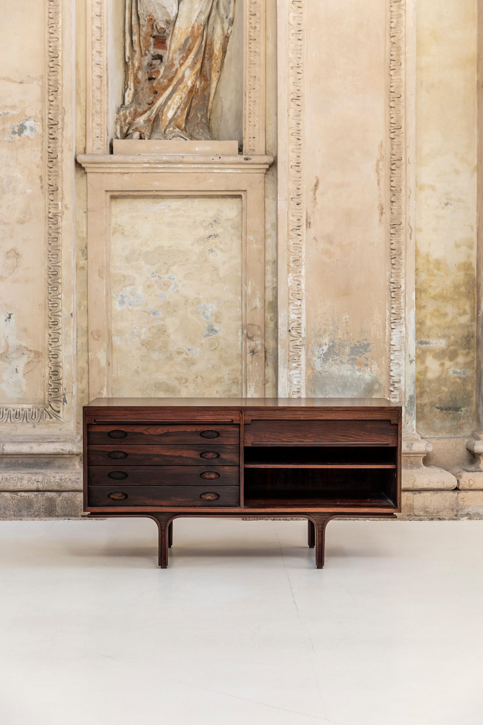 Iconic sideboard design by Gianfranco Frattini, manufactured by Bernini in Italy 1960. 
Two vertical tambour doors, four drawers on the left side and adjustable shelve in the other section.
Beautiful details and finishes.
