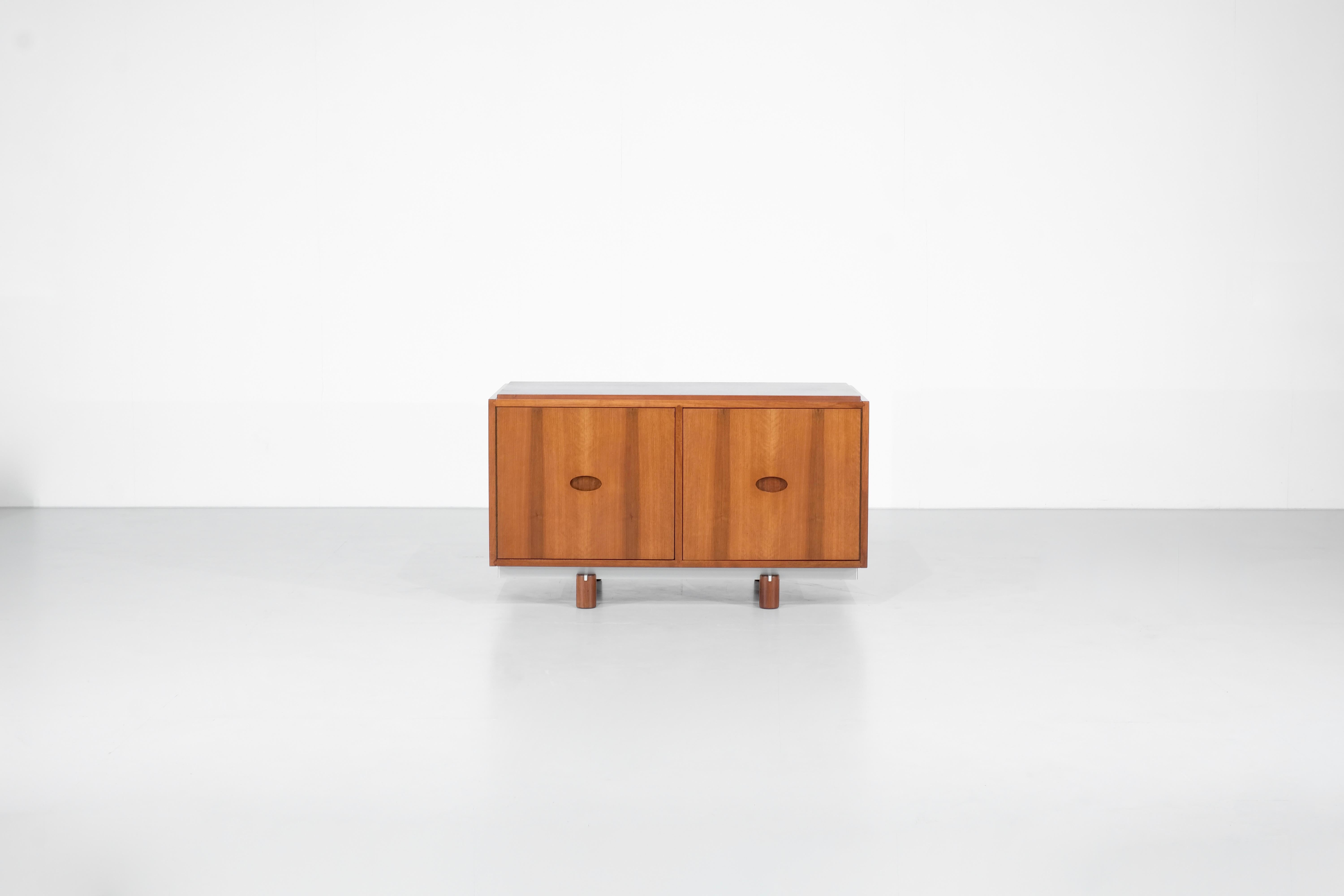 Sideboard Buffet present two doors  for each side, with beautiful carved handles of oval shape, four cylindrical feet and a metal finish.

Designed by Gianfranco Frattini for Bernini, Italy 1960s.

 

 

Designer - Gianfranco Frattini.

Producer -