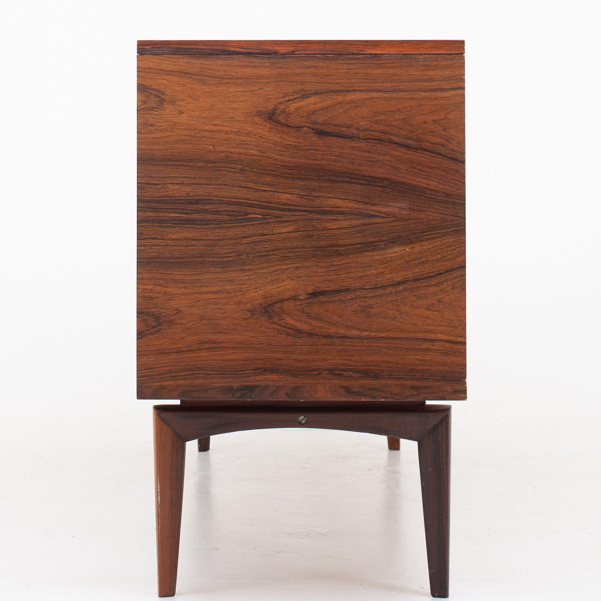 Sideboard in rosewood with tambour and drawers. Maker Bramin Møbelfabrik.