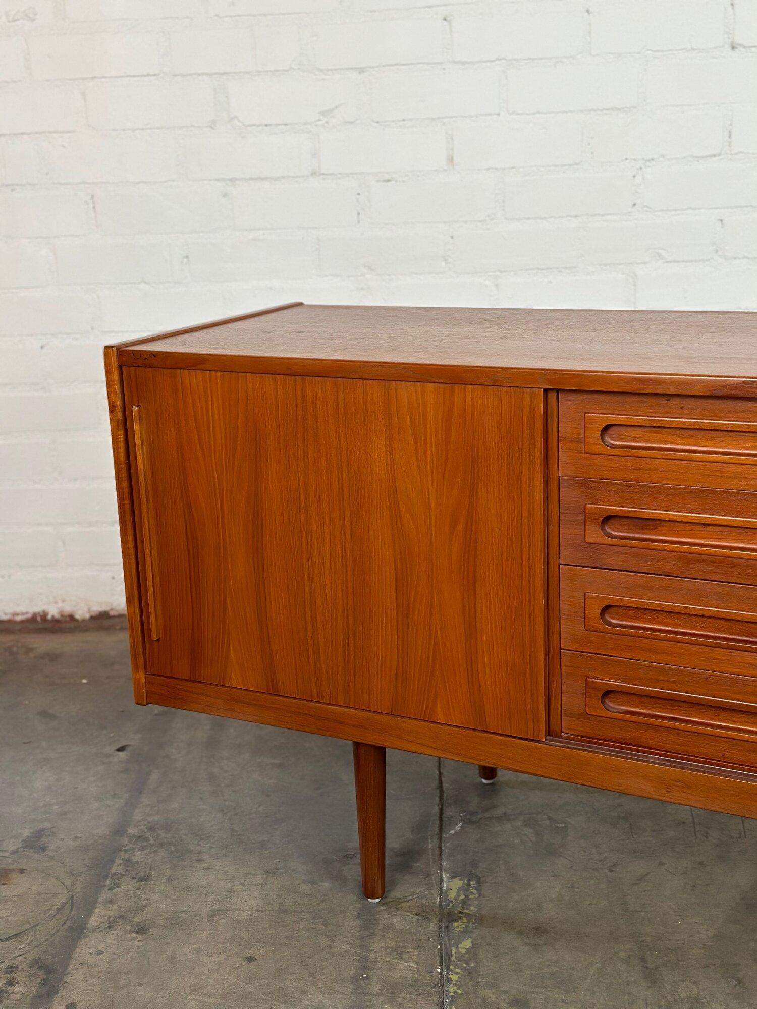 W79 D19.75 H30.5

Sideboard in fully restored condition in Teak. Item is structurally and sturdy with no major areas of wear. Sideboard features sculpted pulls, and is finished on all sides.