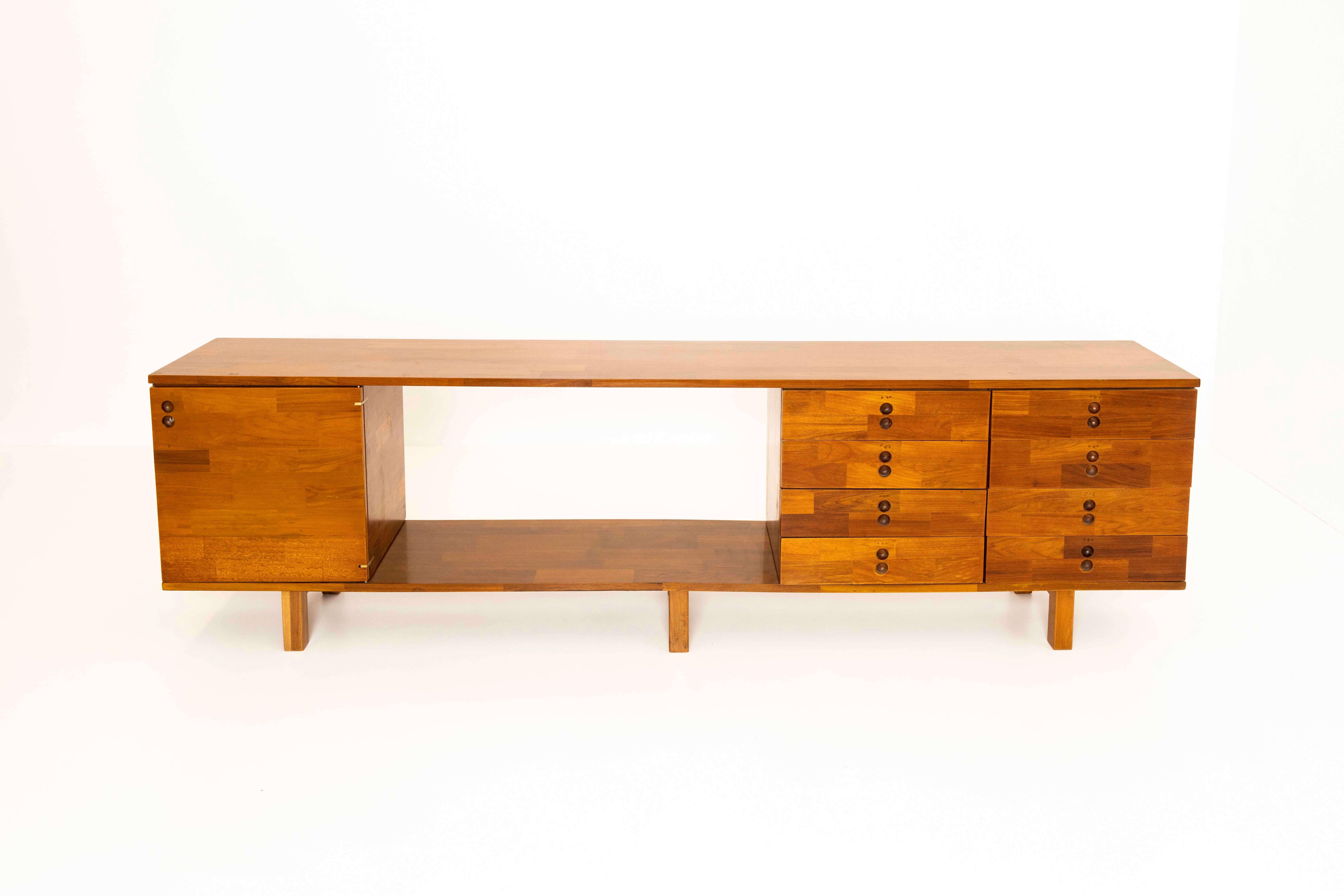 Sideboard by Jorge Zalszupin from his series of 'Modular Pieces' (Modulados Compiníveis) for L'Atelier. This sideboard in imbuia wood (walnut) is designed in Brazil around 1960. It has a finish in 'blocks of wood'. As both the back and the front are