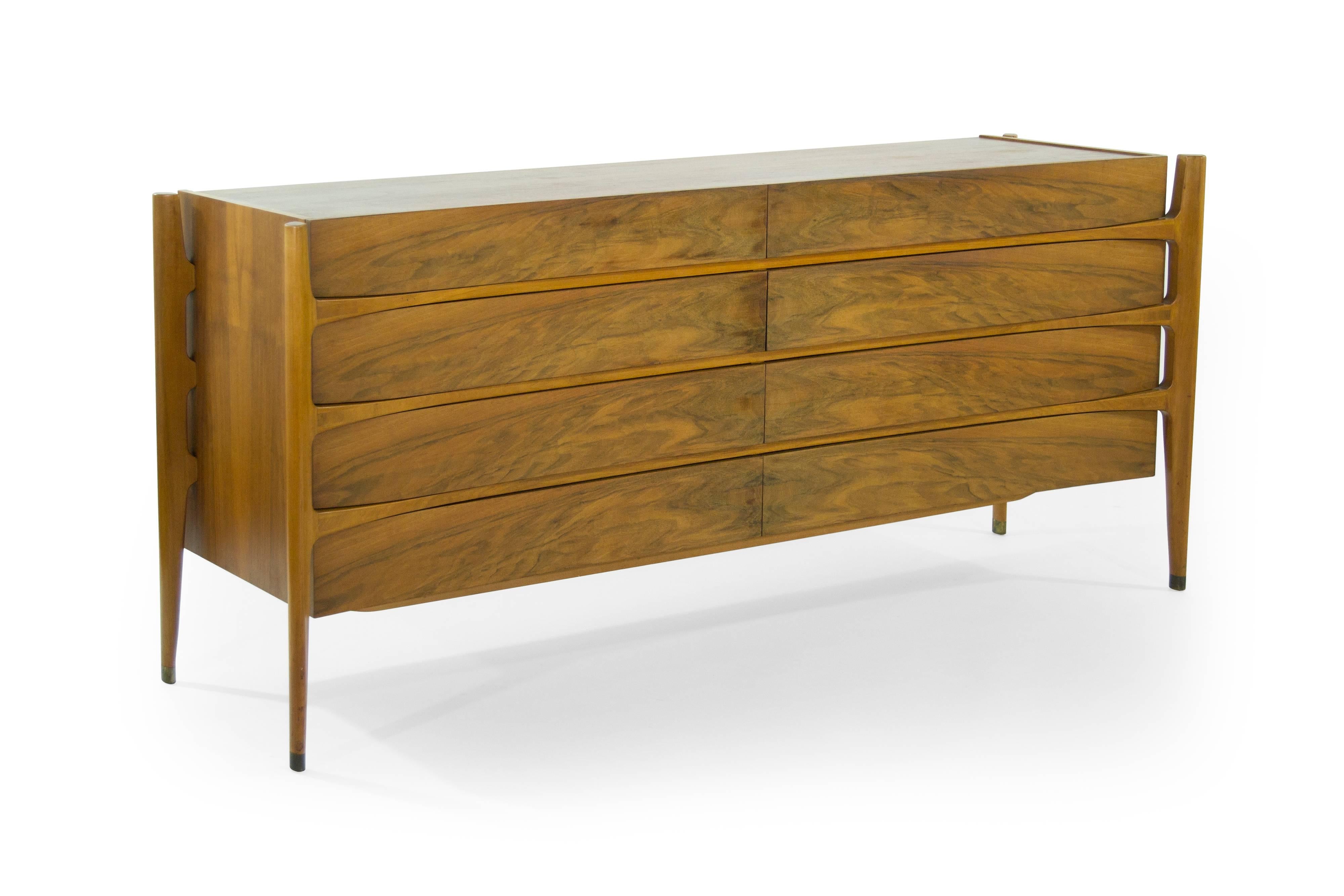 Extremely rare rosewood sideboard or dresser designed by Jorgen Clausen for Brande Møbelfabrik in excellent vintage condition.

Often misattributed to Edmond Spence. This particular piece features bookmatched drawers, exterior framing and brass