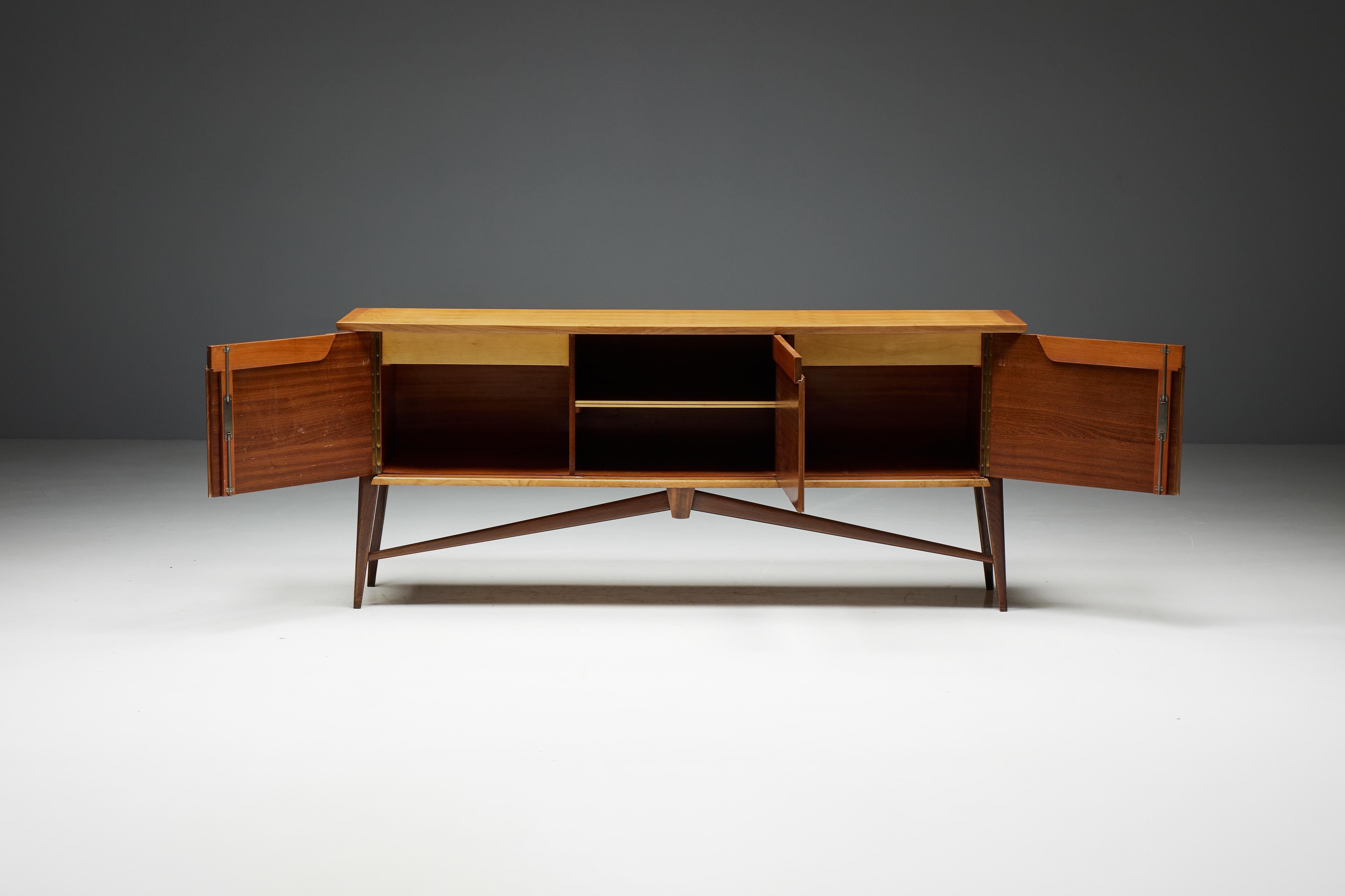 Credenza for De Coene, crafted in 1958 by Belgian designer Paul Van Den Bulcke. This credenza features a captivating two-tone design in cherry wood and walnut, creating a harmonious blend of warm hues and rich textures. The free-form pin legs