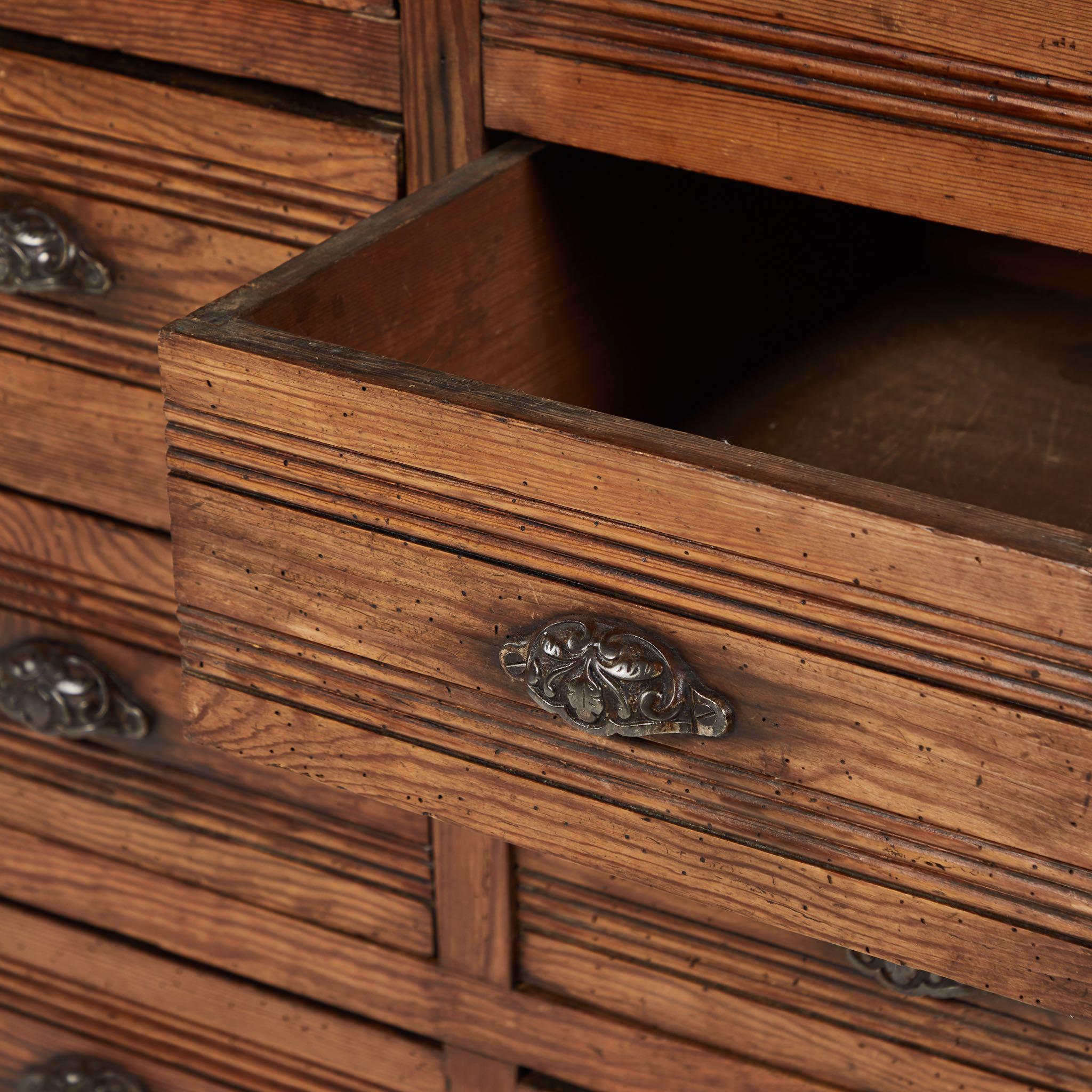 A sideboard chest of drawers with stone top, originating in France circa 1890.