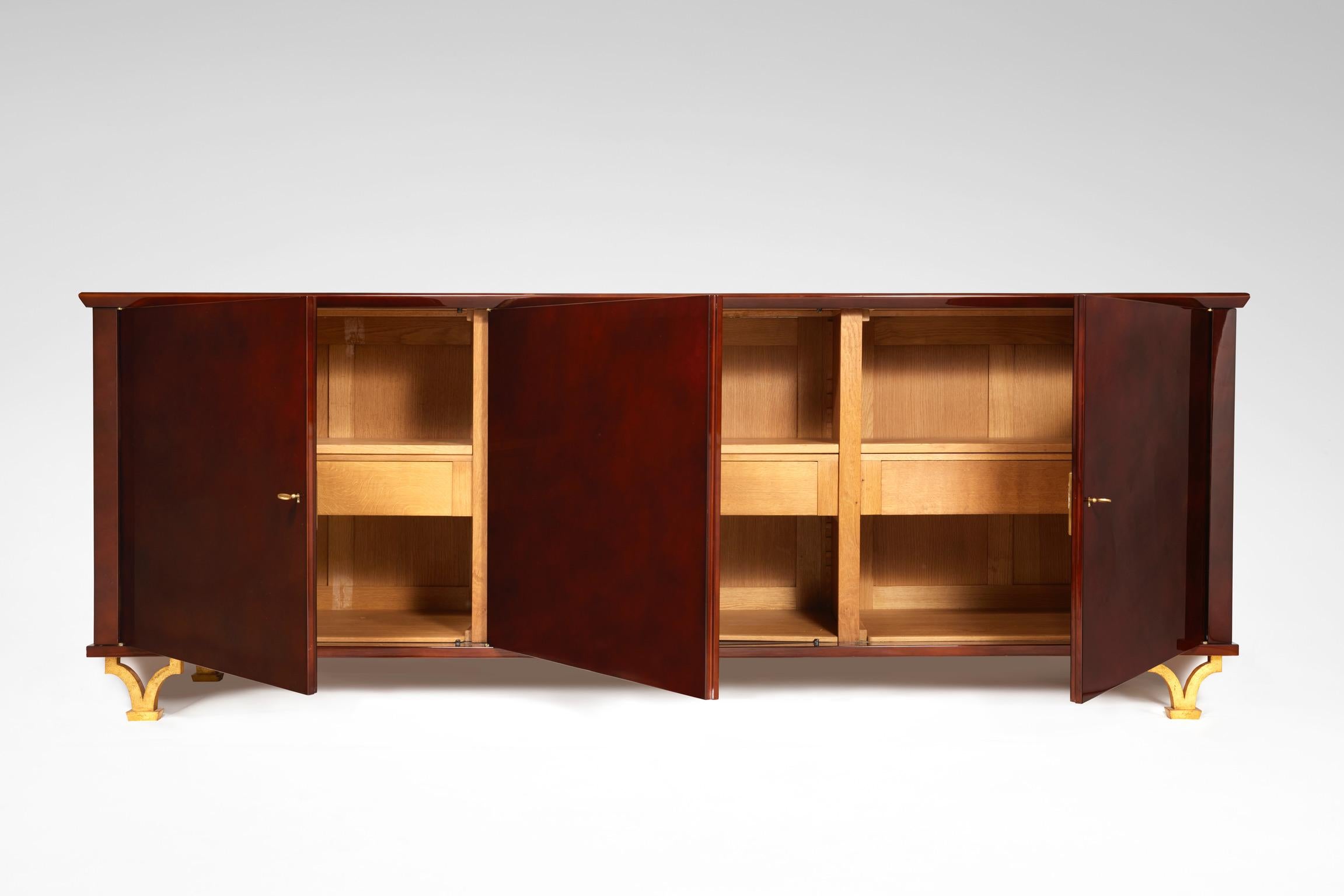 Lacquered sideboard in oak, wood and gilt-wrought iron designed by Gilbert Poillerat.