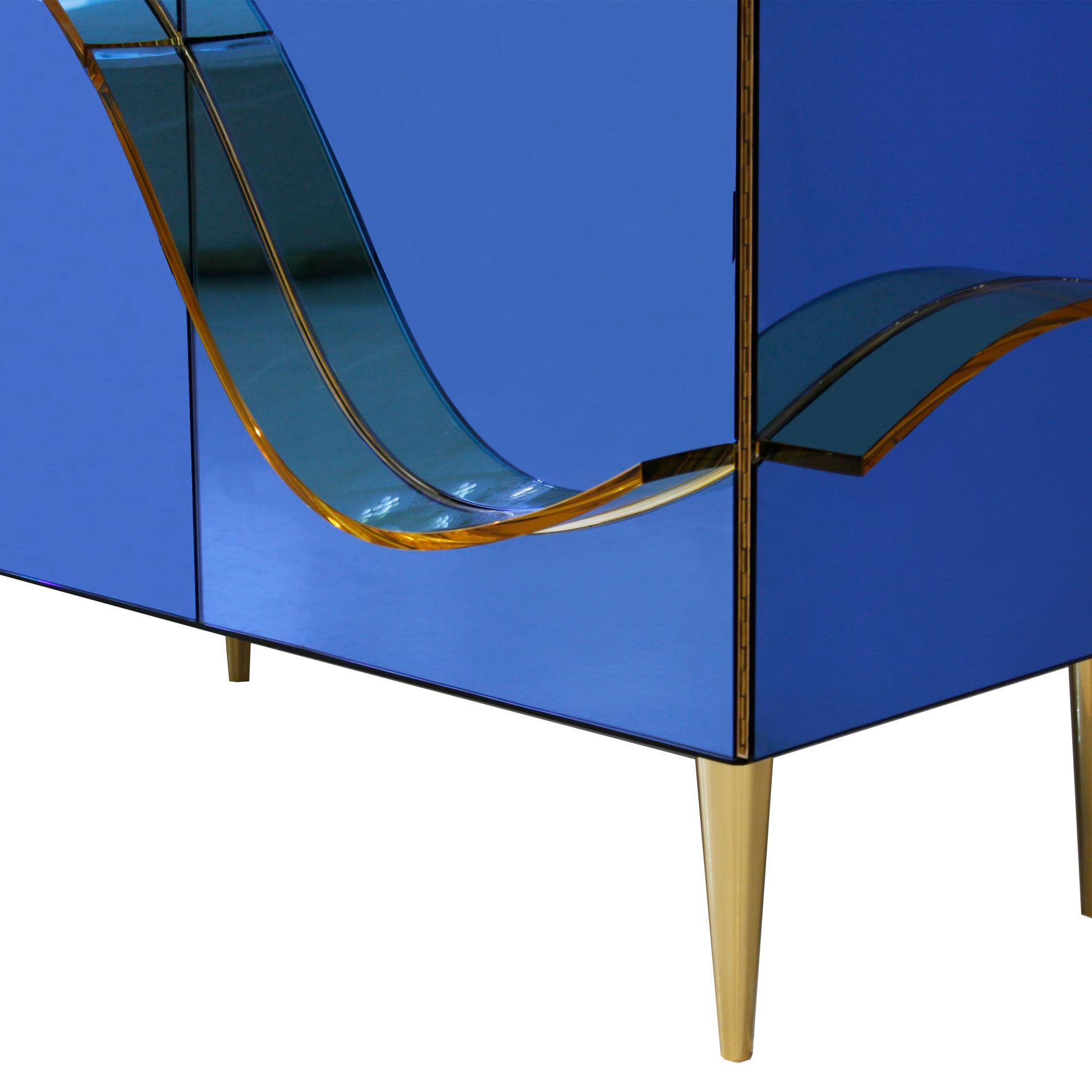 Sideboard made with solid birch wood structure, covered in blue glass and mirror. Decorative Murano glass applications on the surface, carved and molded by hand.

Every item LA Studio offers is checked by our team of 10 craftsmen in our in-house