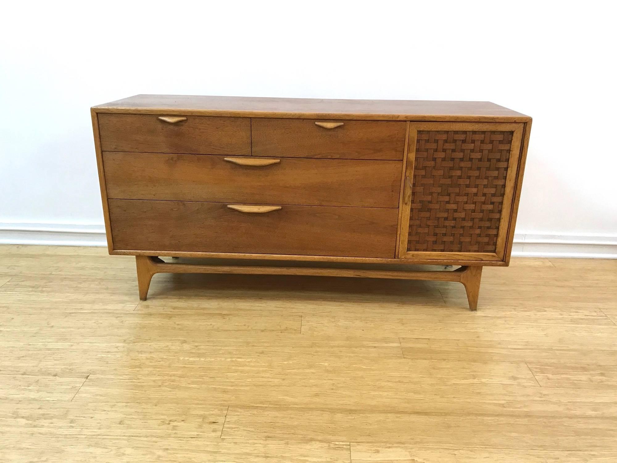 Gorgeous walnut credenza / sideboard from Lane Furniture's Perception series designed by Warren Church. Features three full drawers and a side cabinet with the signature 