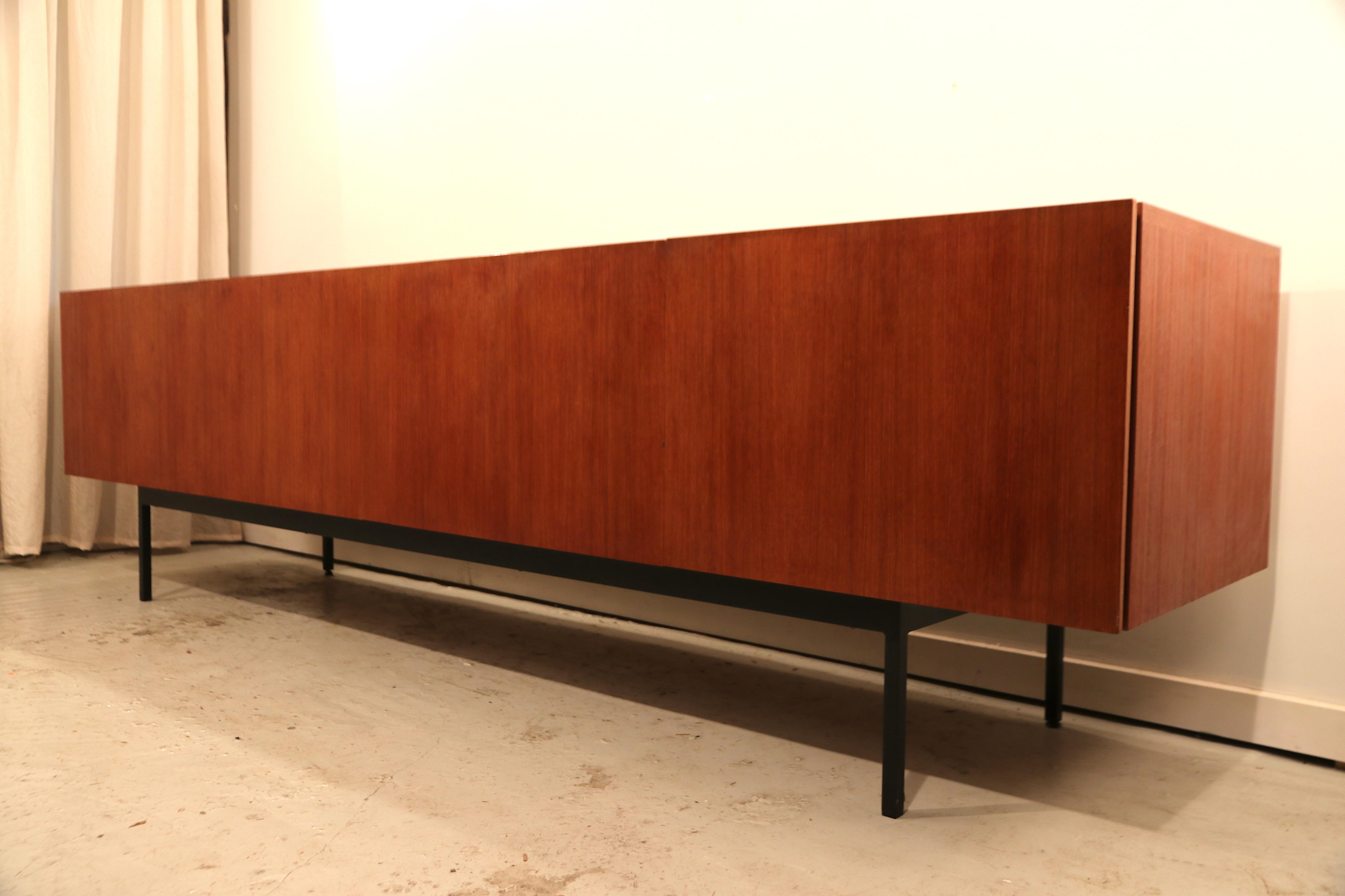 Large Minimalist rare sideboard model B40 by Dieter Waeckerlin for German manufacturer Behr. The outside is teak, and the inside has a beautifully finished maple wood interior with drawers, shelves and a removable dry bar with soft pastel blue