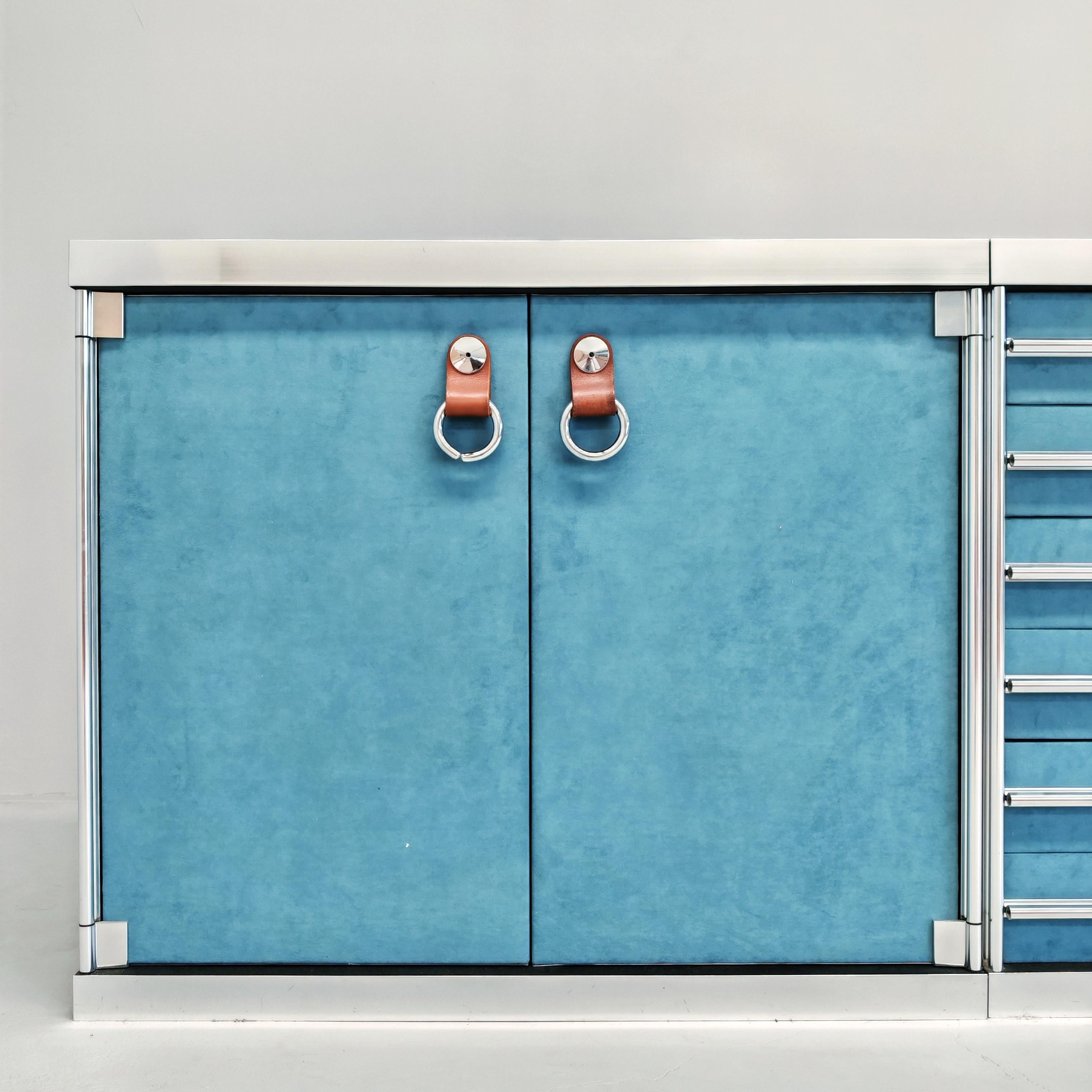 Gorgeous modular credenza, designed by Guido Faleschini for i4 Mariani on commission from Hermès boutiques in the 1970s.
The cabinet consists of:
- two storage units with doors covered in light blue suede fabric
- hermès leather handles
- a central