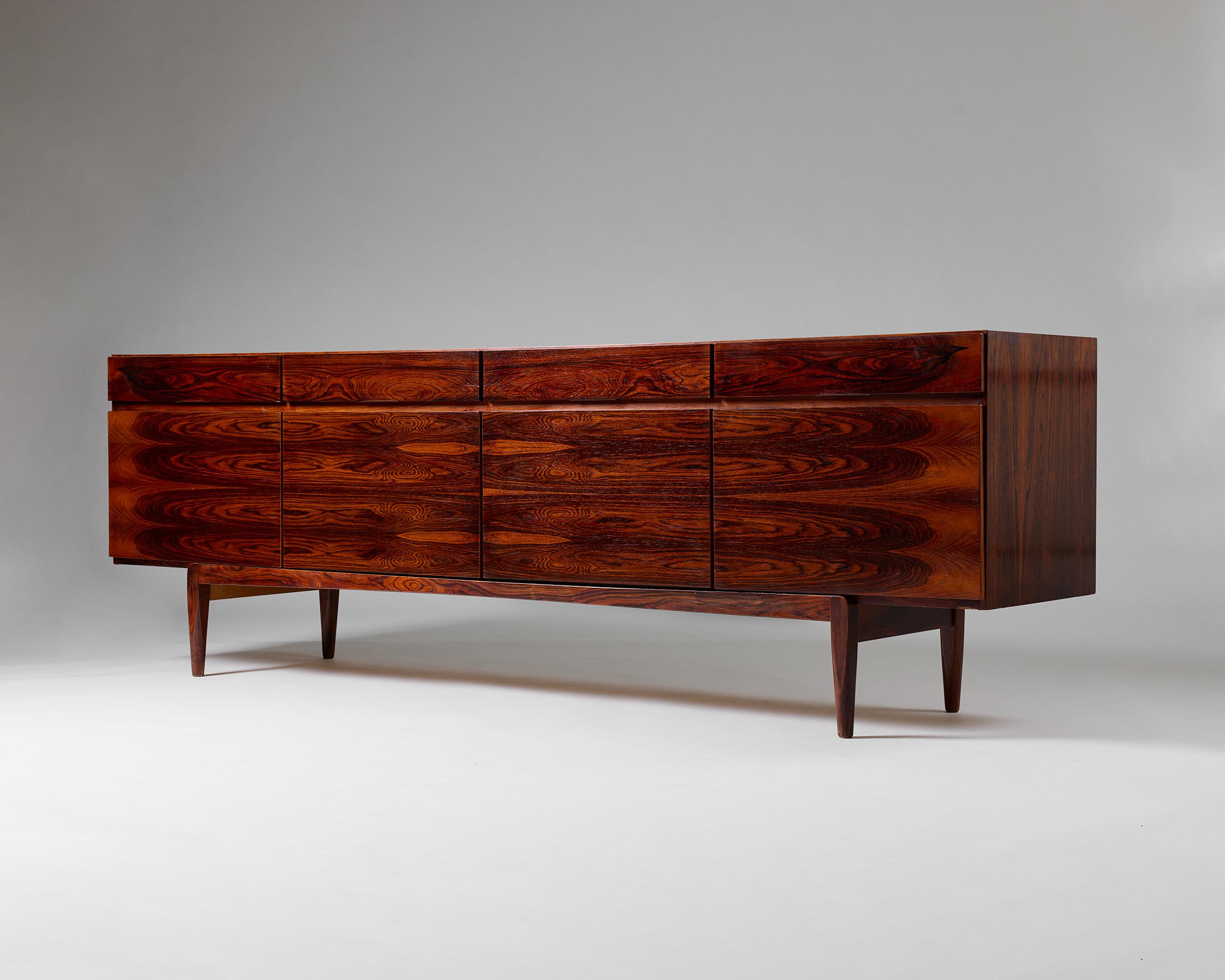 Sideboard designed by Ib Kofod-Larsen
Denmark, 1960s

Rosewood.

Private Danish collection. 

H: 76 cm / 7' 6 1/2''
L: 230 cm / 7' 6''
W: 50 cm / 2' 5 1/2''