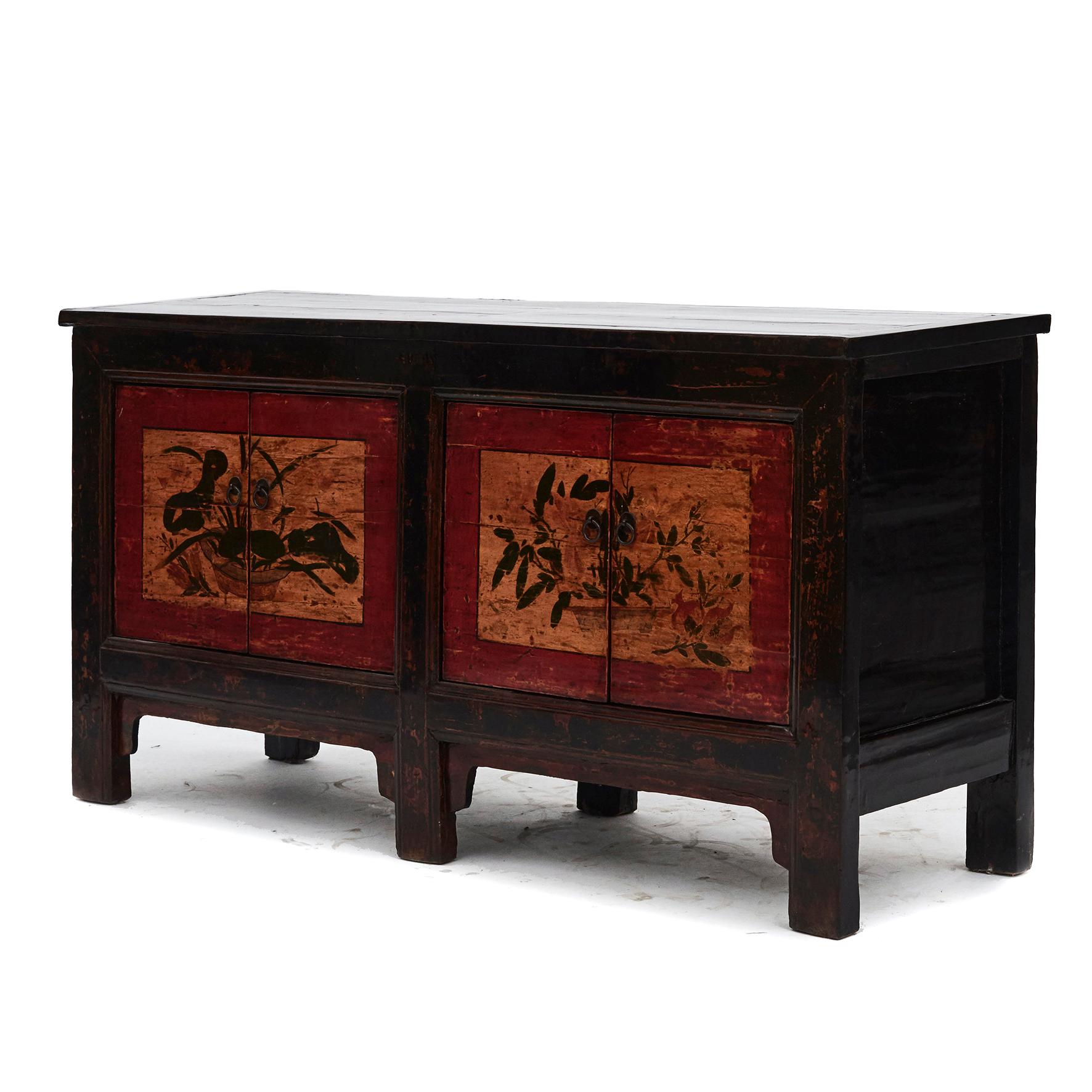Sideboard in elm wood from Shandong province in China.
Black lacquer, with two pair of doors in polychrome lacquer with decorations.

Natural age-related beautiful patina, highlighted by clear lacquer surface finish.