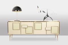 Sideboard in cream opaline glass and gilded bronze. Contemporary.