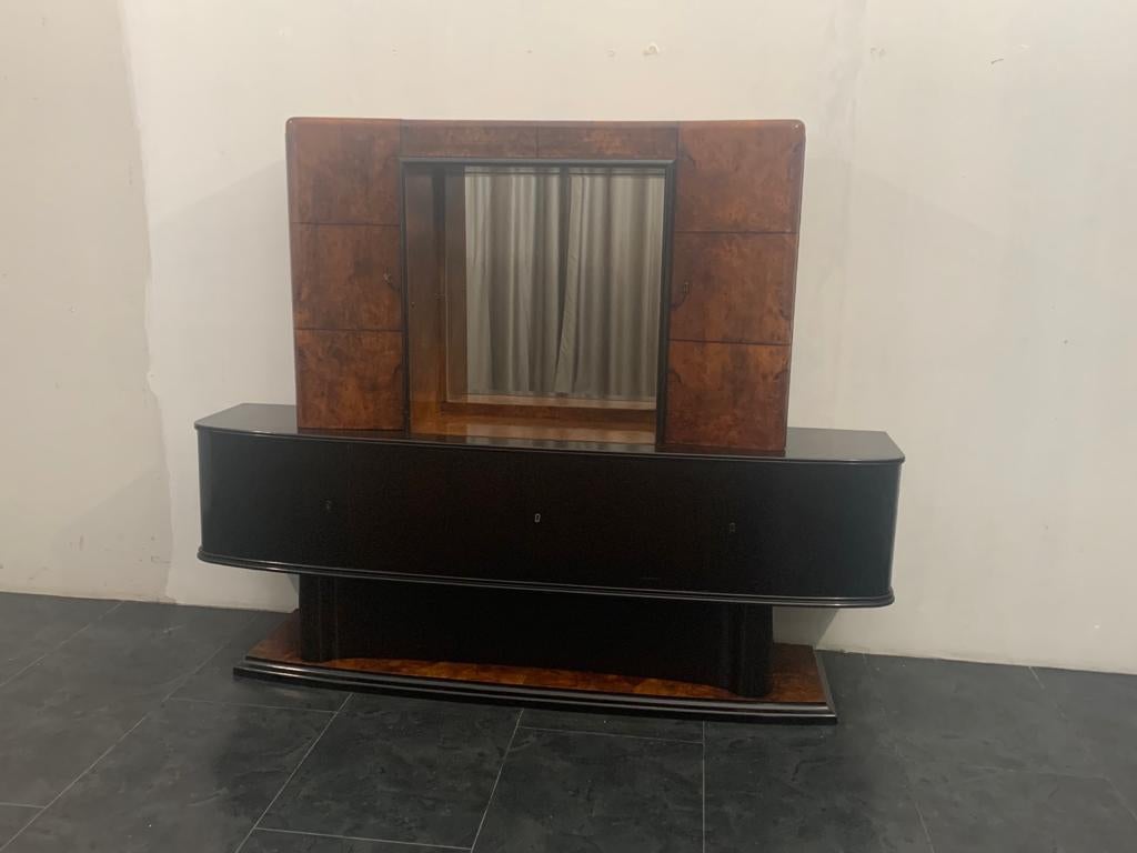 Sideboard with ebonized riser and tuja briar laid open and divided into squares by ebony fillet of generous dimensions. Latch for key in ivory.