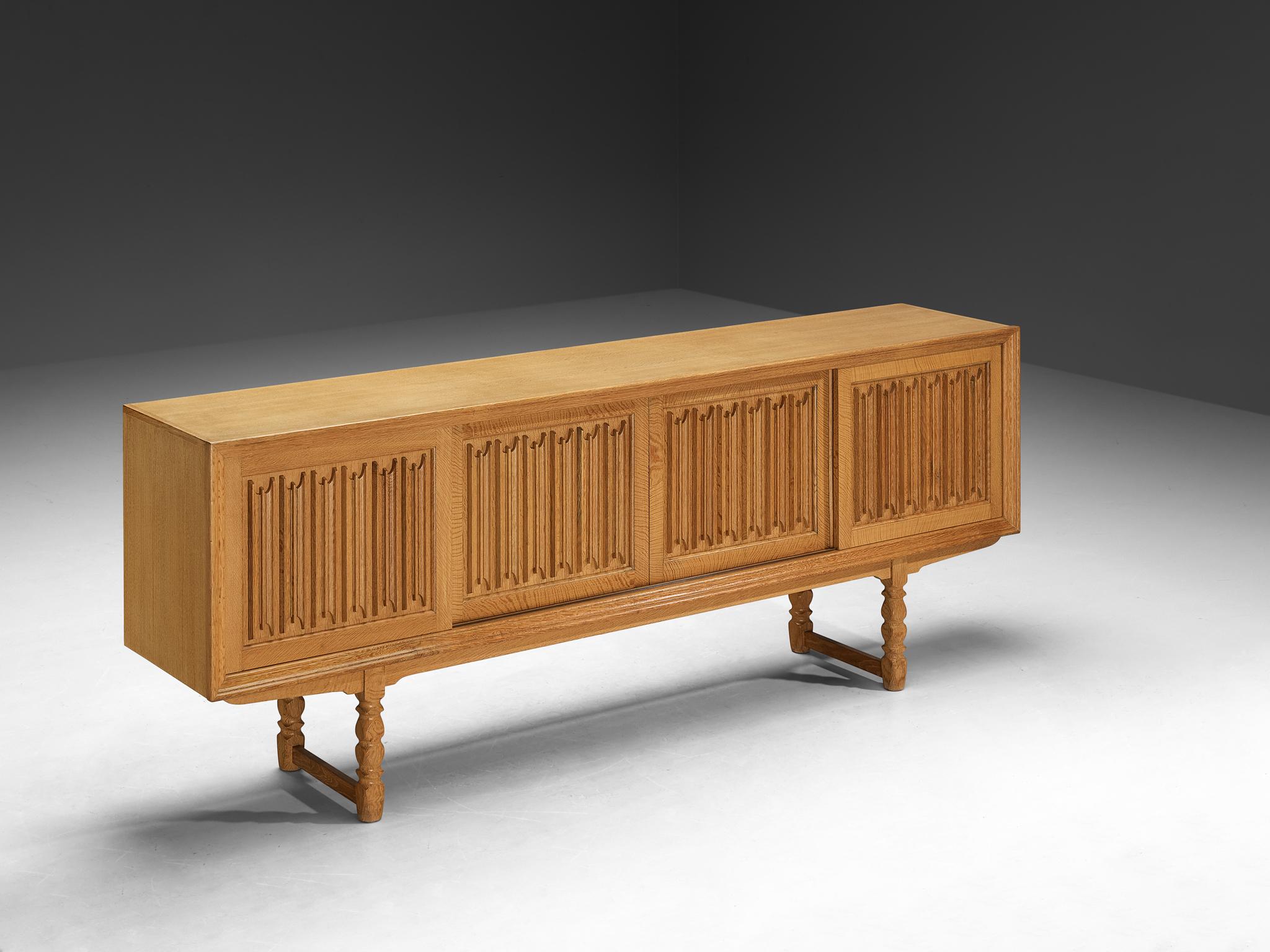 Sideboard, oak, Denmark, 1950s

Originating from Denmark, this credenza is designed around the 1950s by a skilled cabinetmaker whose identity remains unknown. The designer clearly understood how to design a high-quality piece of furniture. An