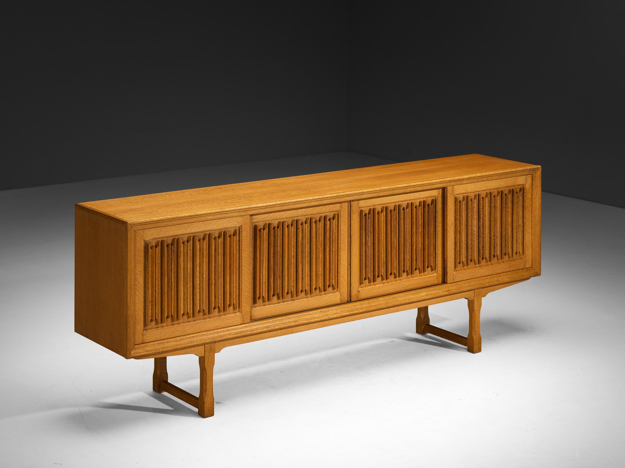 Sideboard, oak, Denmark, 1950s

Originating from Denmark, this large cabinet is designed around the 1950s by a skilled cabinetmaker whose identity remains unknown. The designer clearly understood how to design a high-quality piece of furniture. An