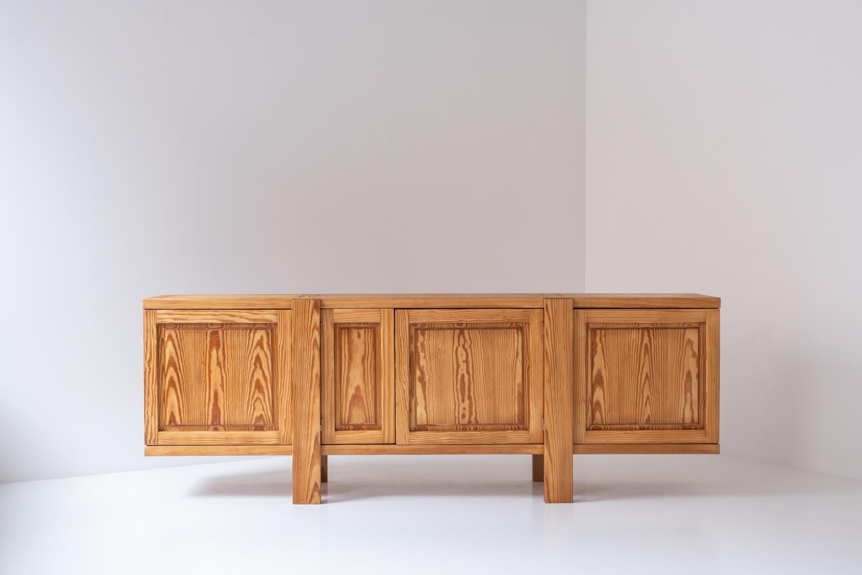 Very interesting and well proportioned sideboard sourced in France, designed and produced in the 1960s.  This credenza is made out of solid pine wood and is obviously inspired by the famous and highly sought after R16 sideboard by Pierre Chapo.