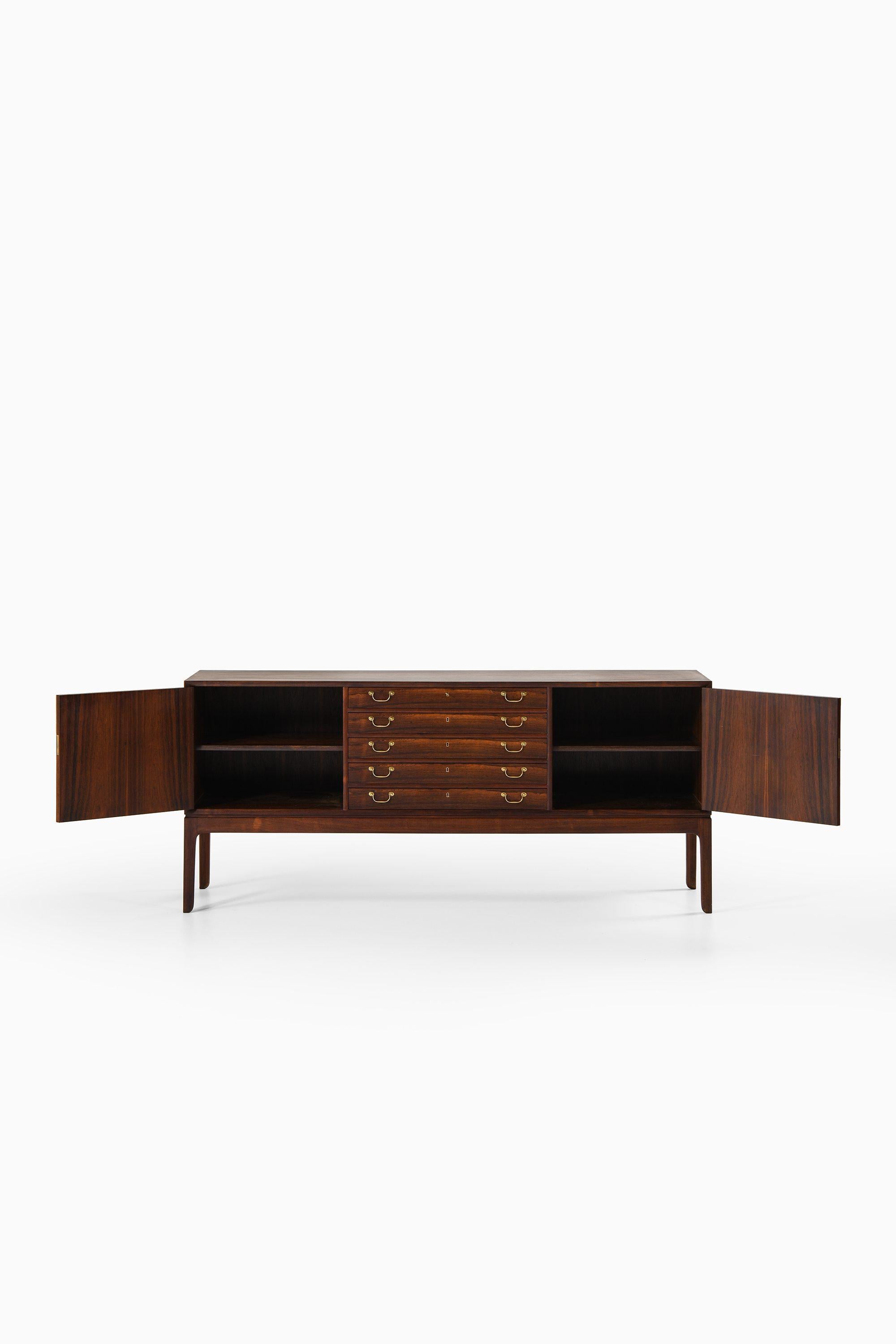 Scandinavian Modern Sideboard in Rosewood and brass by Ole Wanscher For Sale