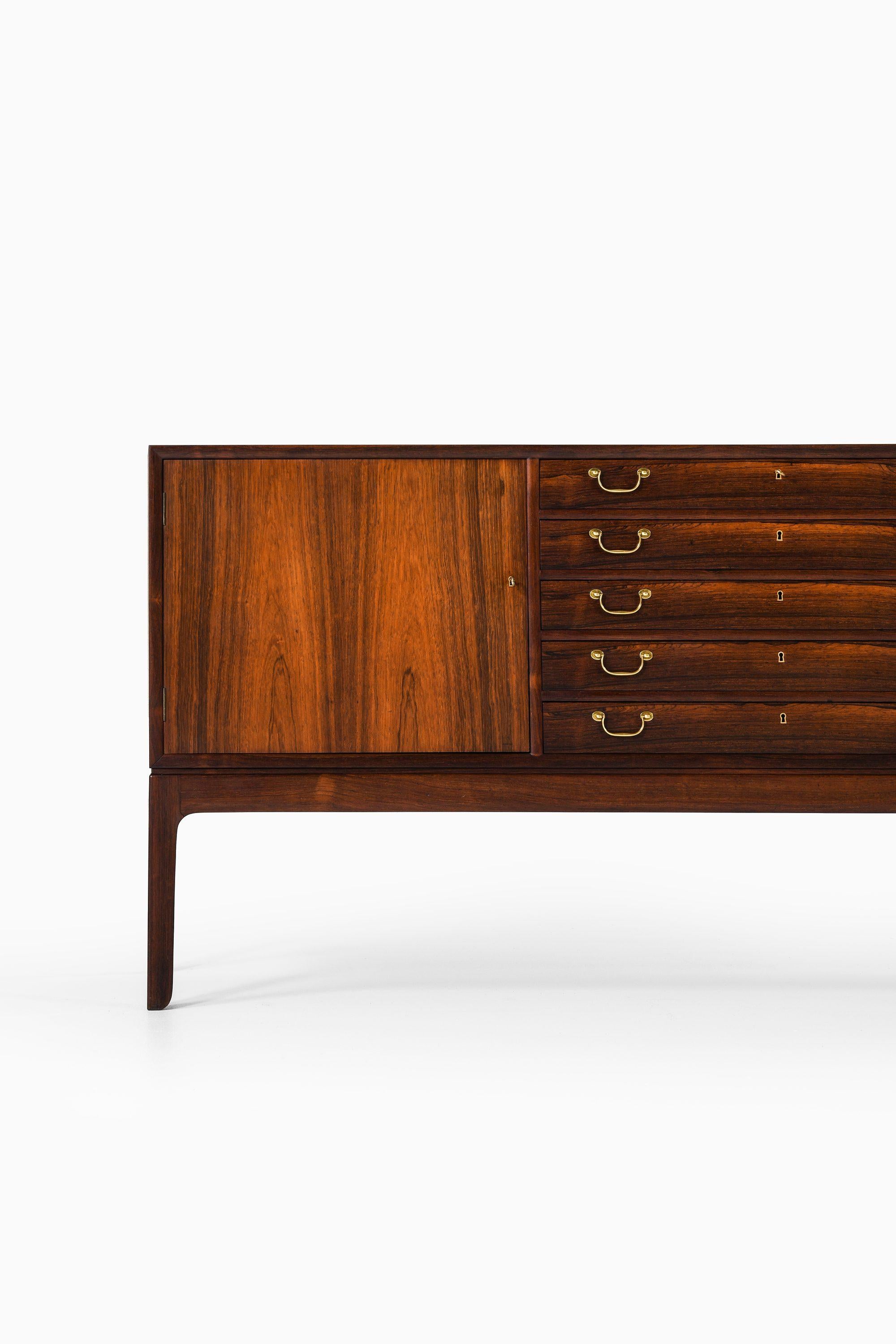 Danish Sideboard in Rosewood and brass by Ole Wanscher For Sale