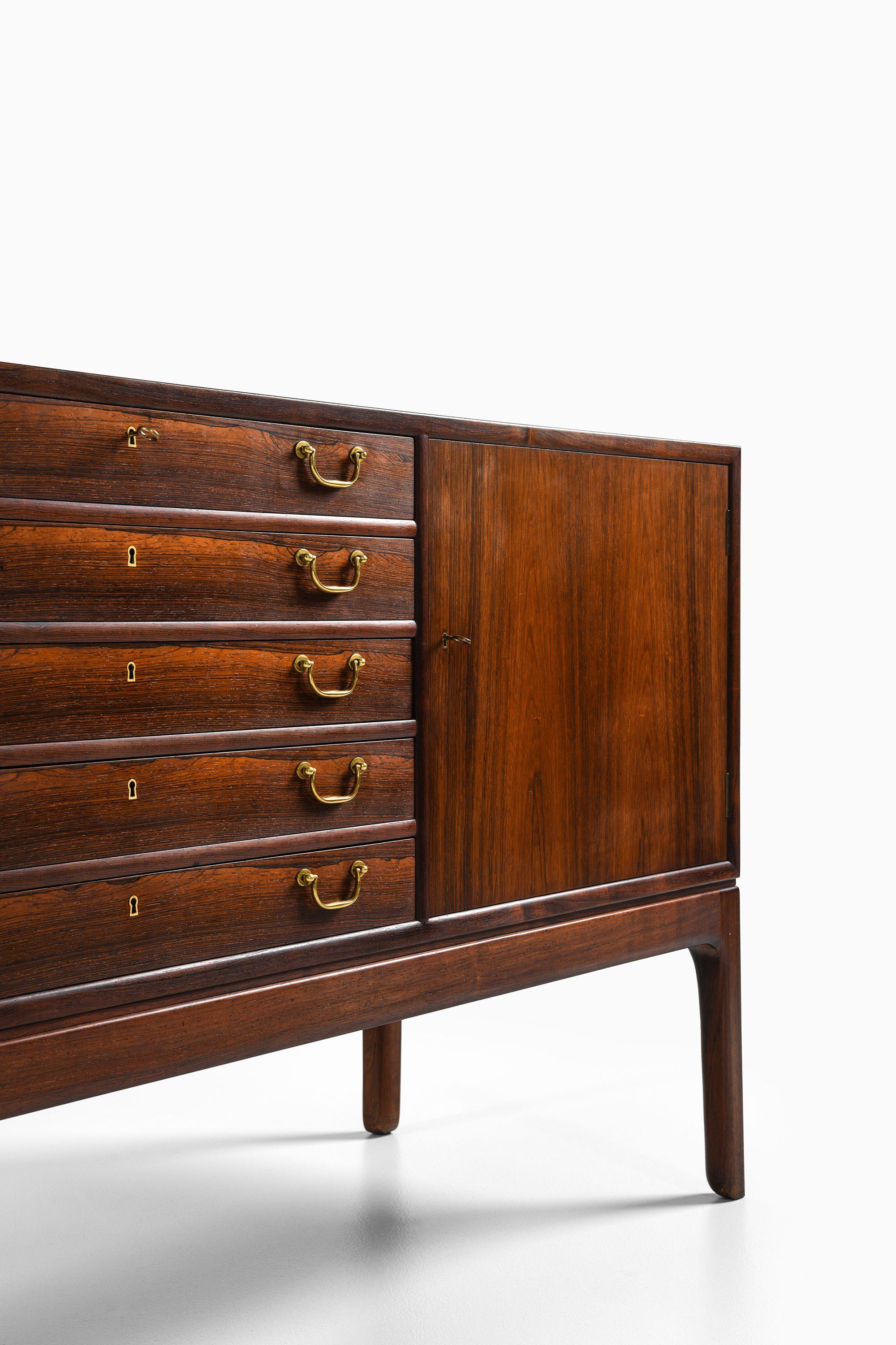 Mid-20th Century Sideboard in Rosewood and brass by Ole Wanscher For Sale