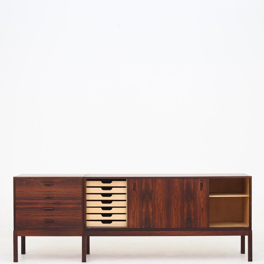 Two-part sideboard in rosewood with drawers and sideboard with sliding doors and interior. Maker Wørts Møbelsnedkeri.