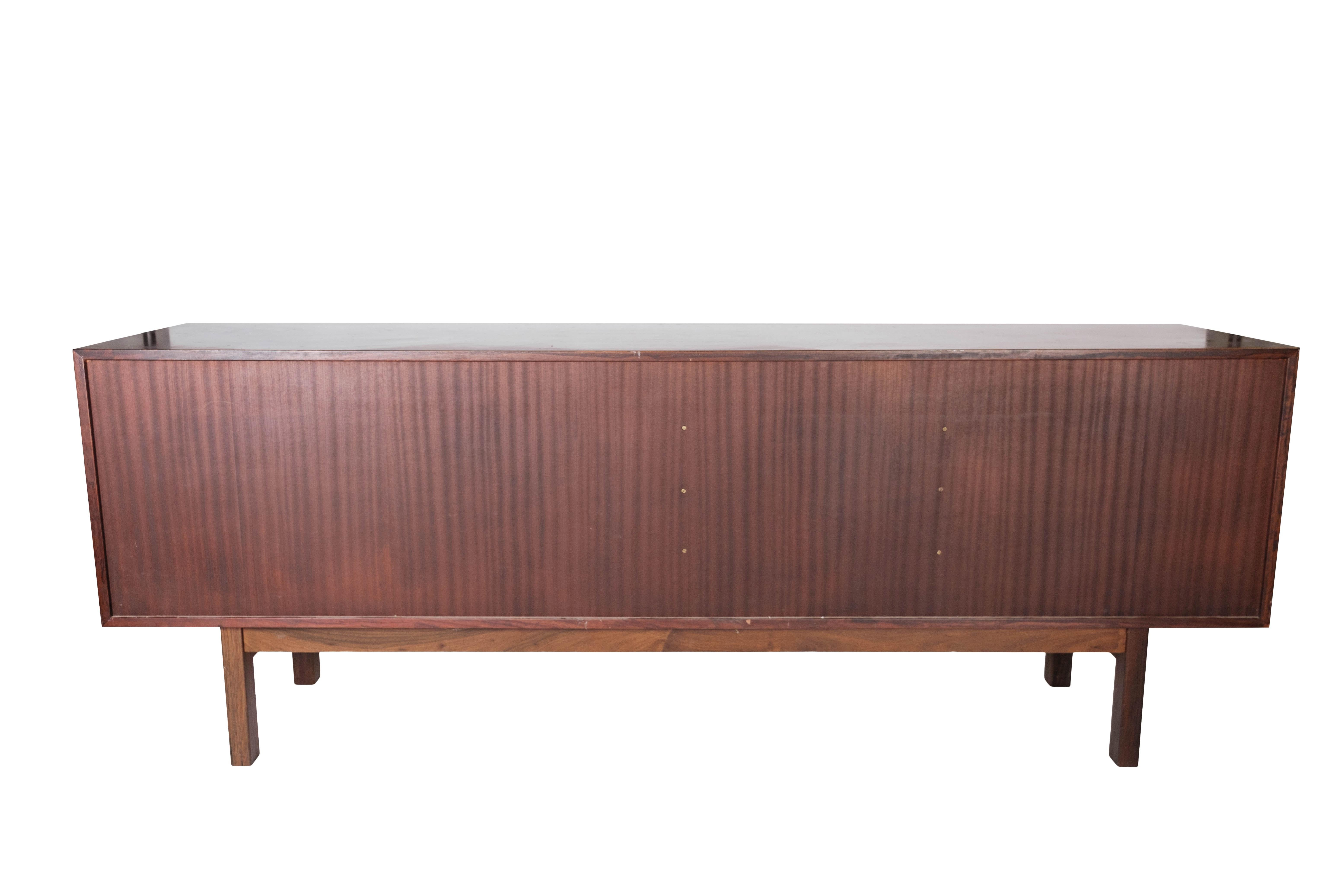 Sideboard in Rosewood with Sliding Doors Designed by Omann Junior from the 1960s In Good Condition In Lejre, DK