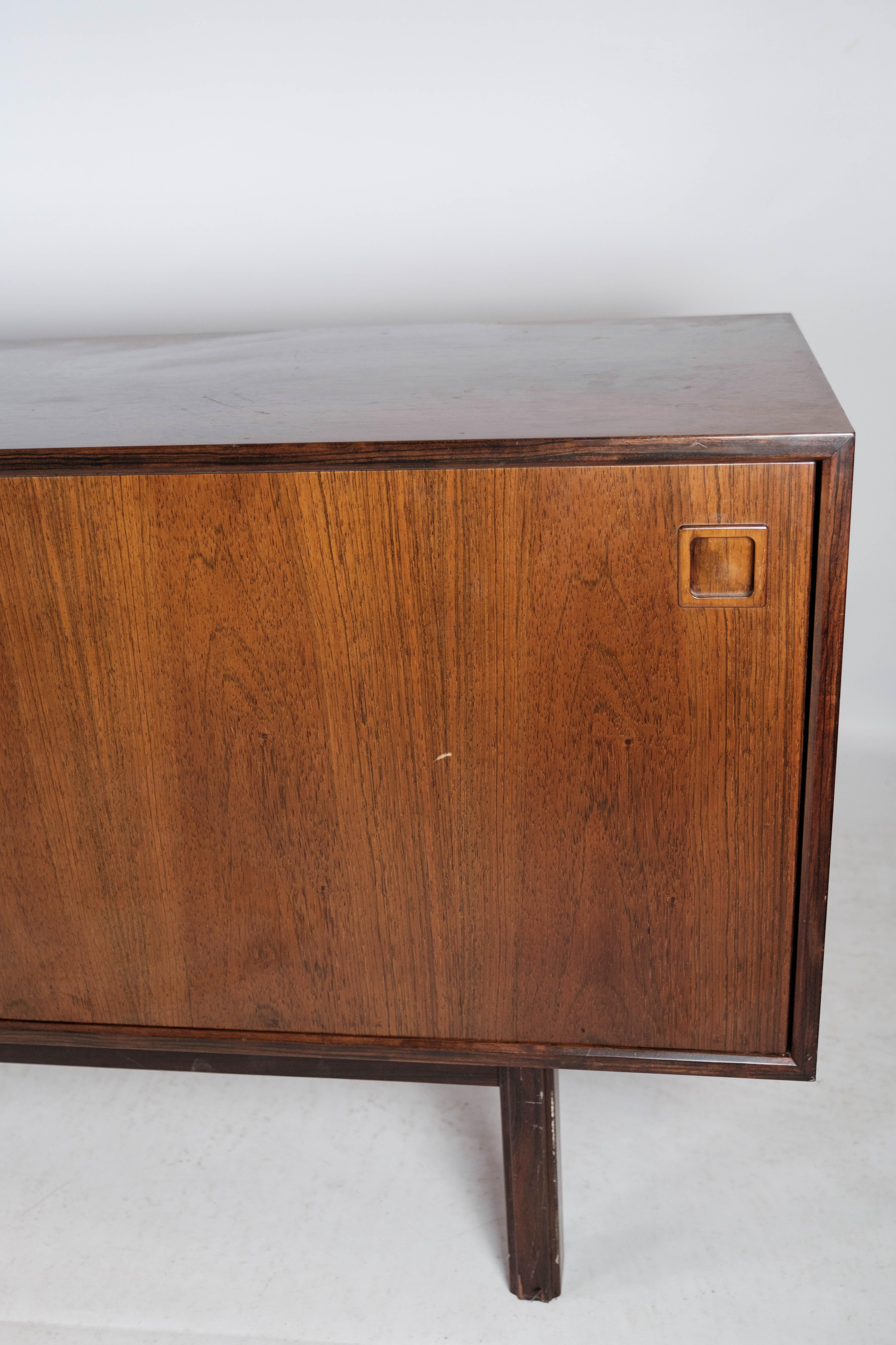 Mid-20th Century Sideboard in Rosewood with Sliding Doors Designed by Omann Junior from the 1960s