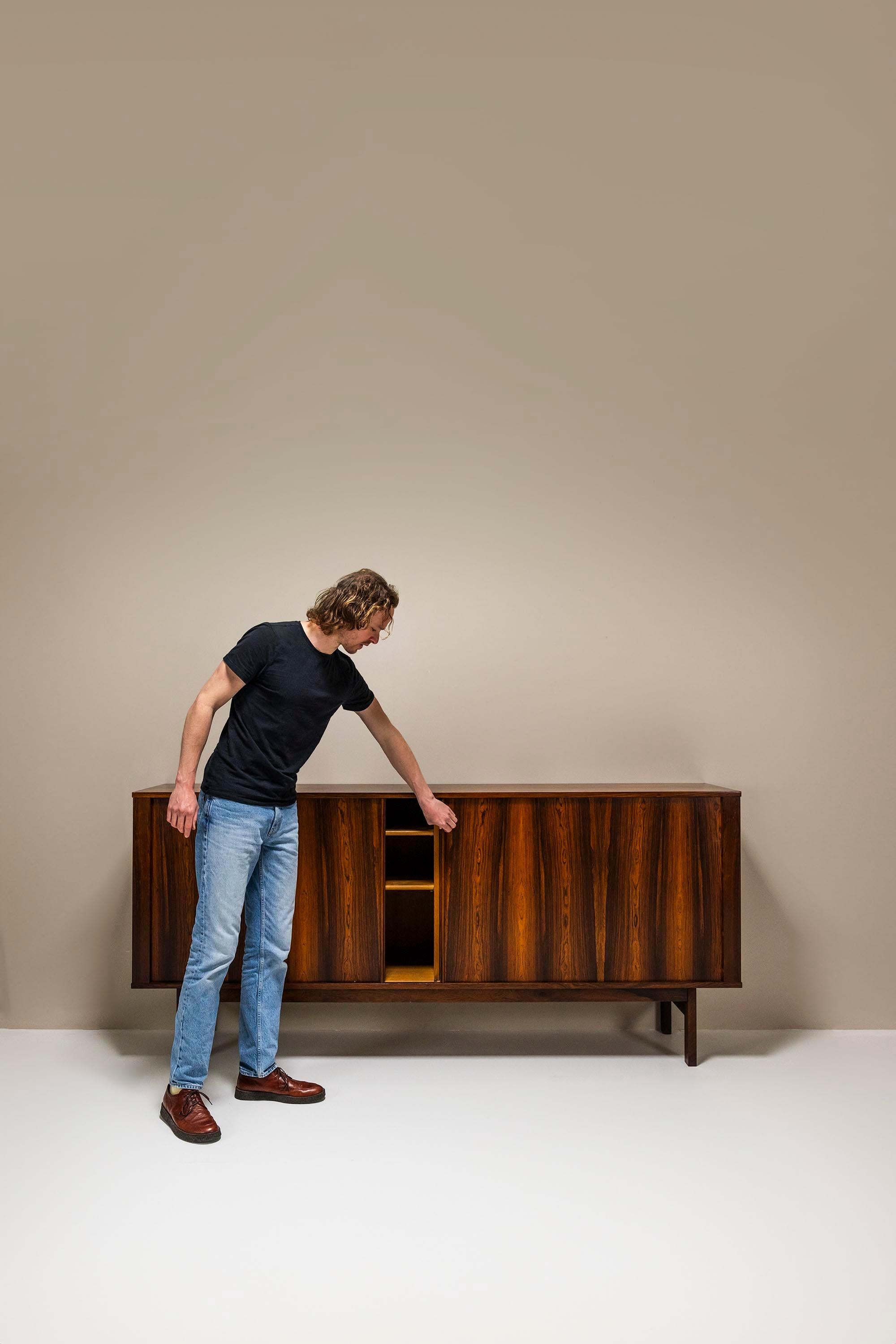 The Danish sideboards are generally spacious and robustly built. Craftsmanship and refined sense of proportion is a constant factor. In addition, they also stood the test of time with verve.

Design
This sideboard has an impressive appearance solely