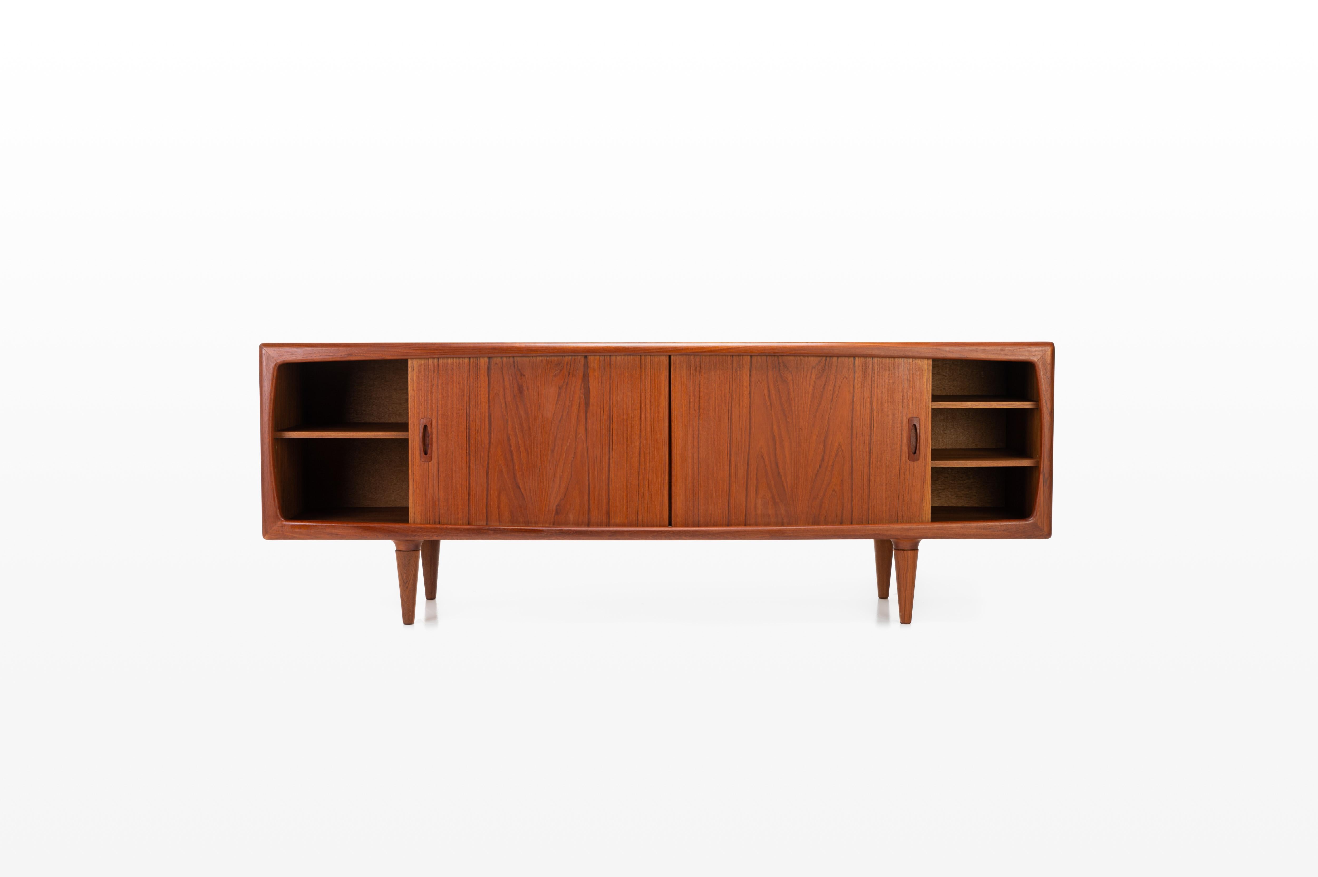 This sideboard is produced by HP Hansen, Denmark. There are two sliding doors, four drawers and shelves. The sideboard is finished in teak and is in very good condition.