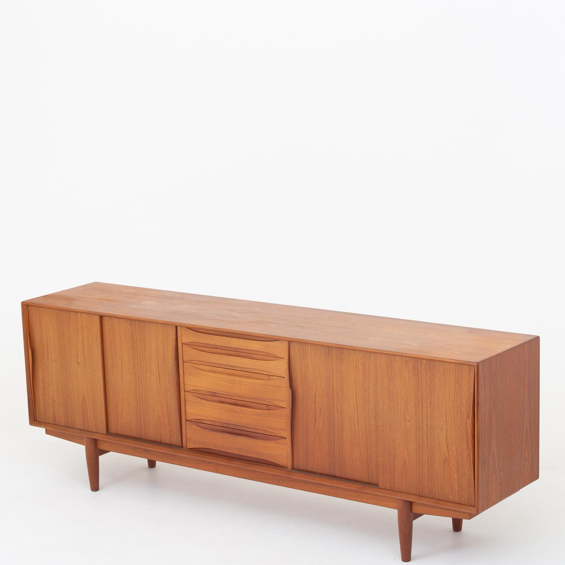 Sideboard in teak with doors and five drawers. Maker Skovby.