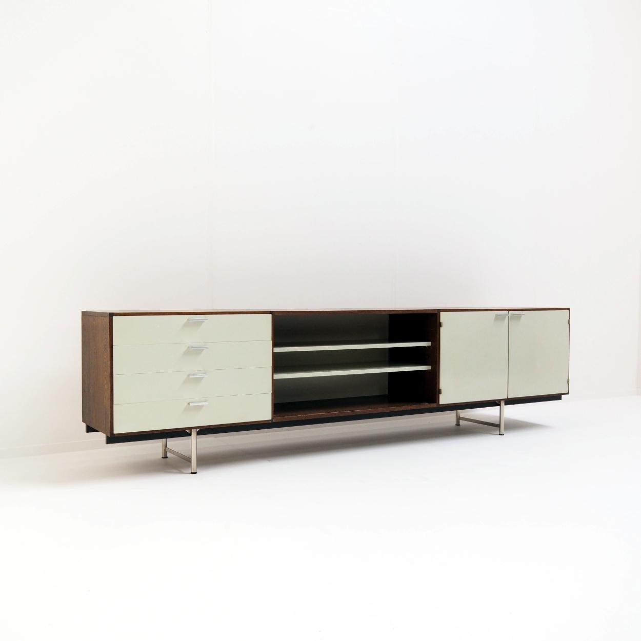 1950s/60s sideboard in wenge wood and white paint designed by Cees Braakman for Pastoe, the Netherlands. It is from the 'Made to Measure' series which was produced from the early 1950s to the mid-1960s.

The sideboard consists of one open