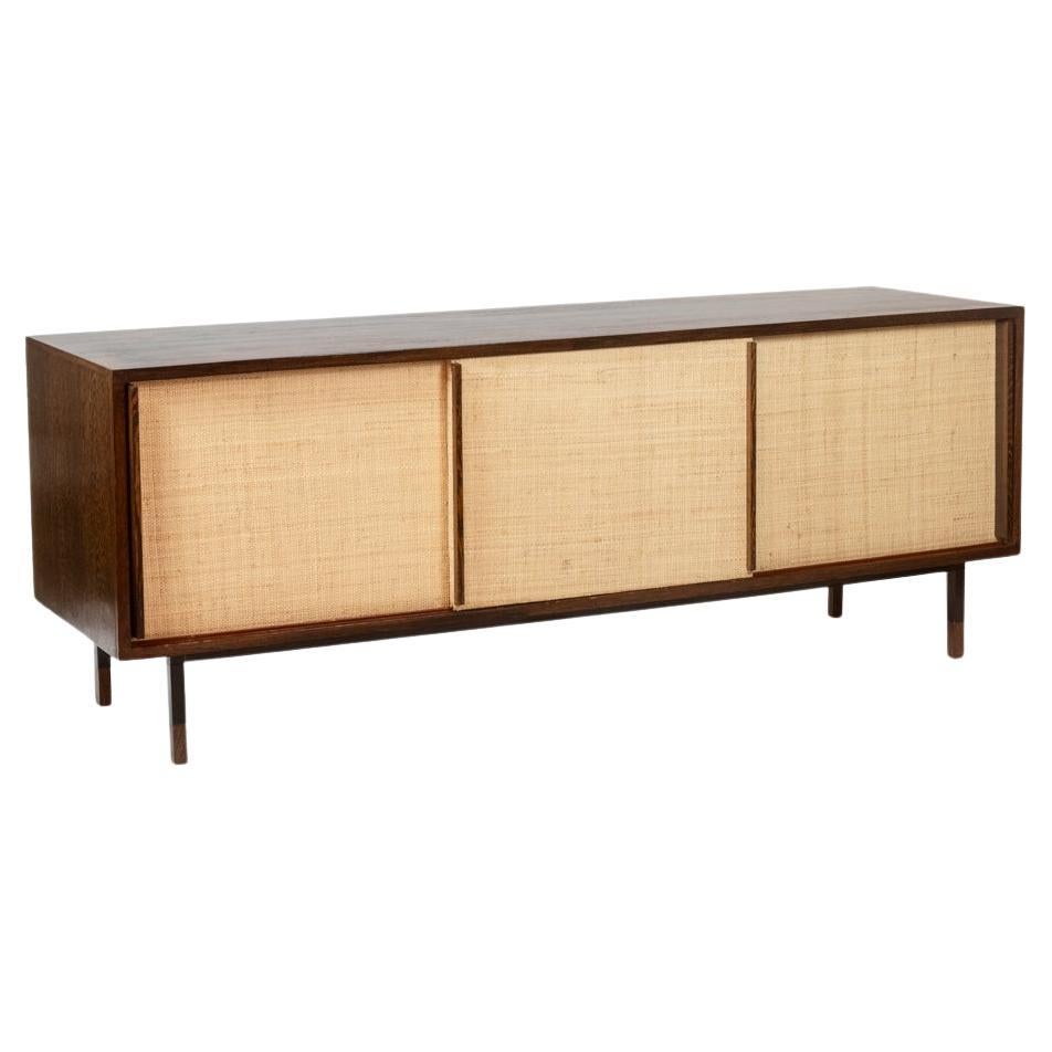 Sideboard in wenge, raffia and lacquered metal. 1970s. For Sale