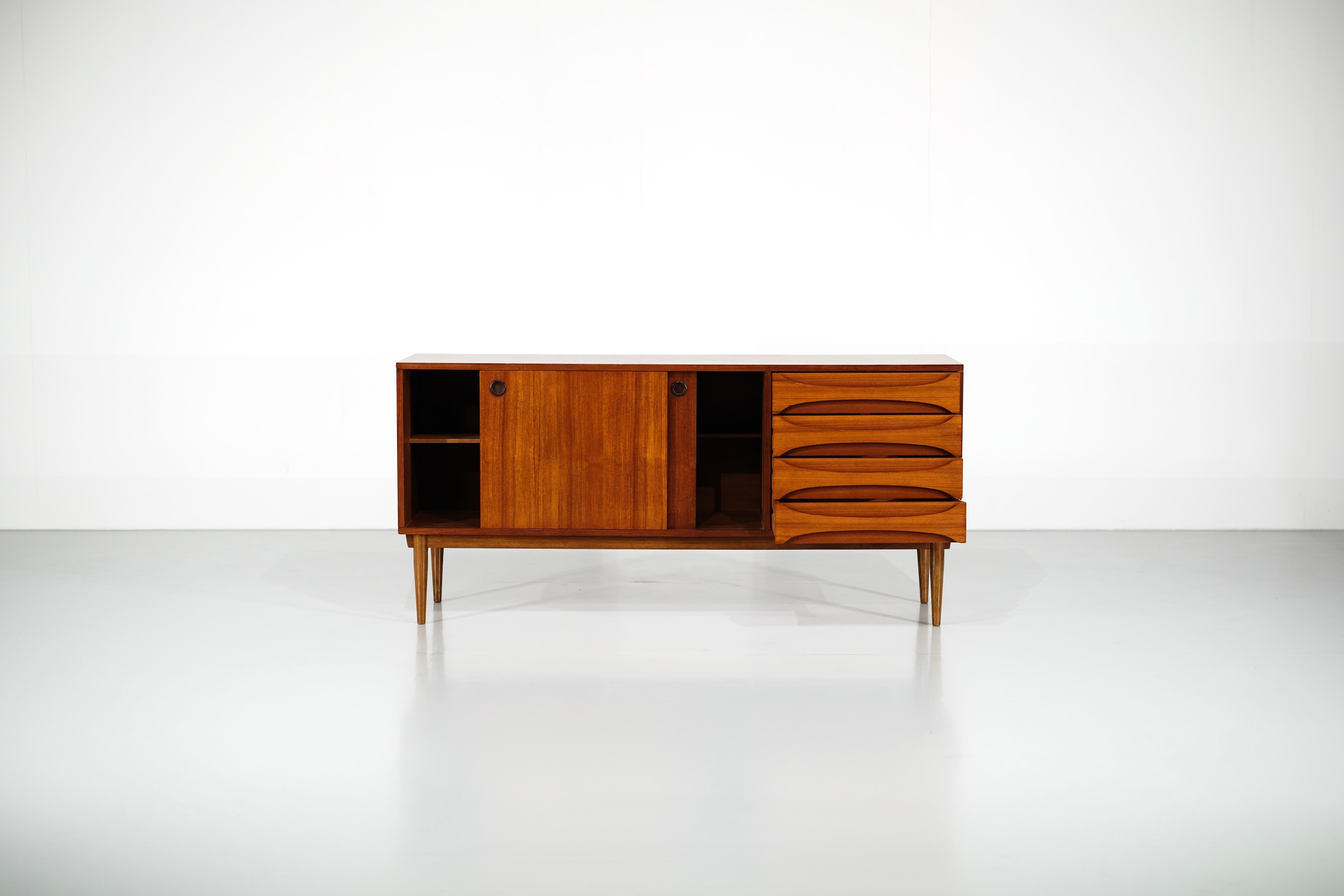 
Sideboard in Wood with two sliding doors and four drawers.

Manufactured in 1960's, full restoration by a professonal.

 
Production period - 1960s.

Measures - Width 170 cm x Depth 45 cm x Height 80 cm.

Materials - Wood.

Color - Brown,