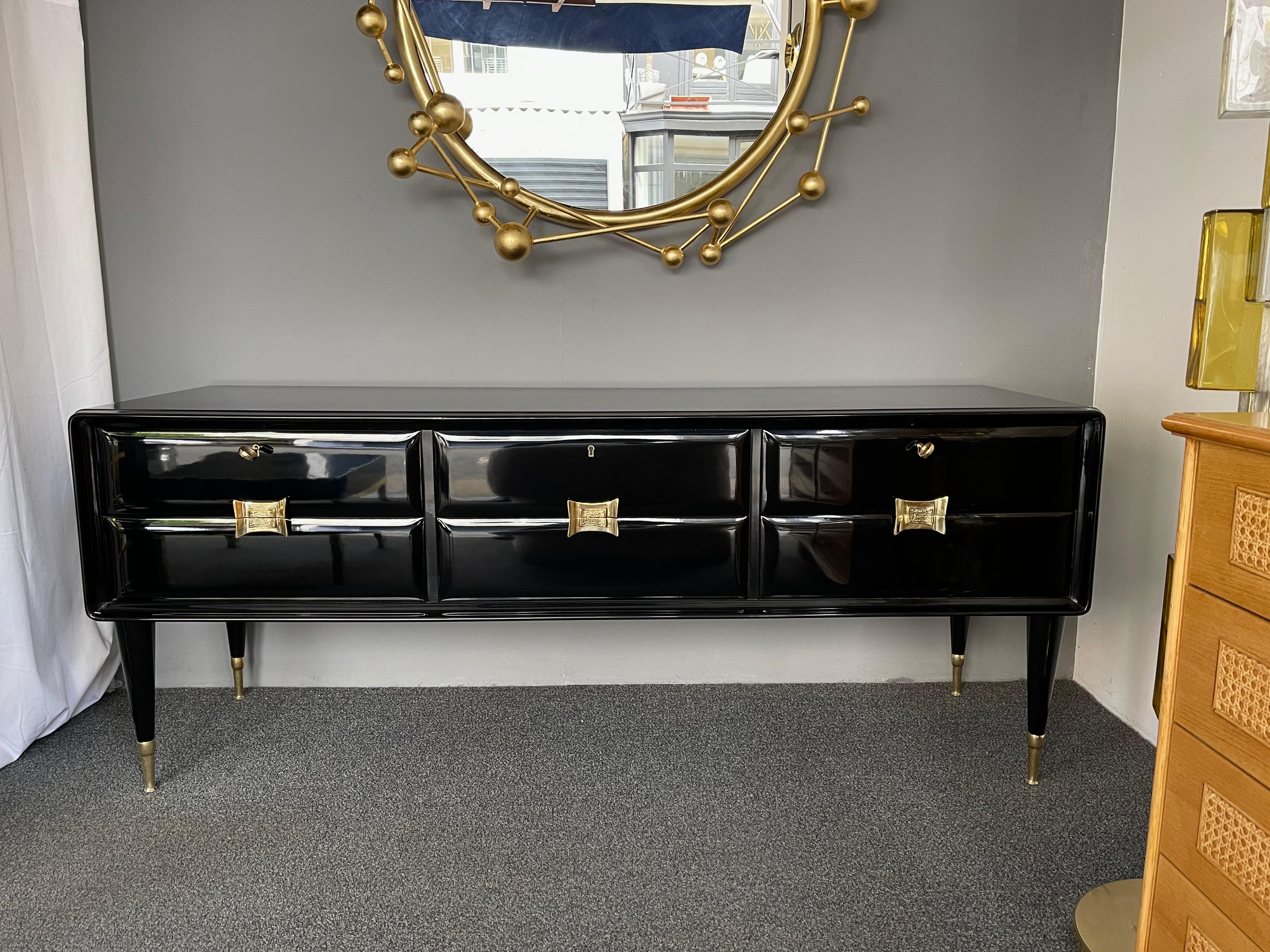 Sideboard credenza buffet or chest of drawers commode in black lacquered wood, brass feet and handle. Also available the nightstands side end tables. Famous design like Gio Ponti, Ico Parisi.