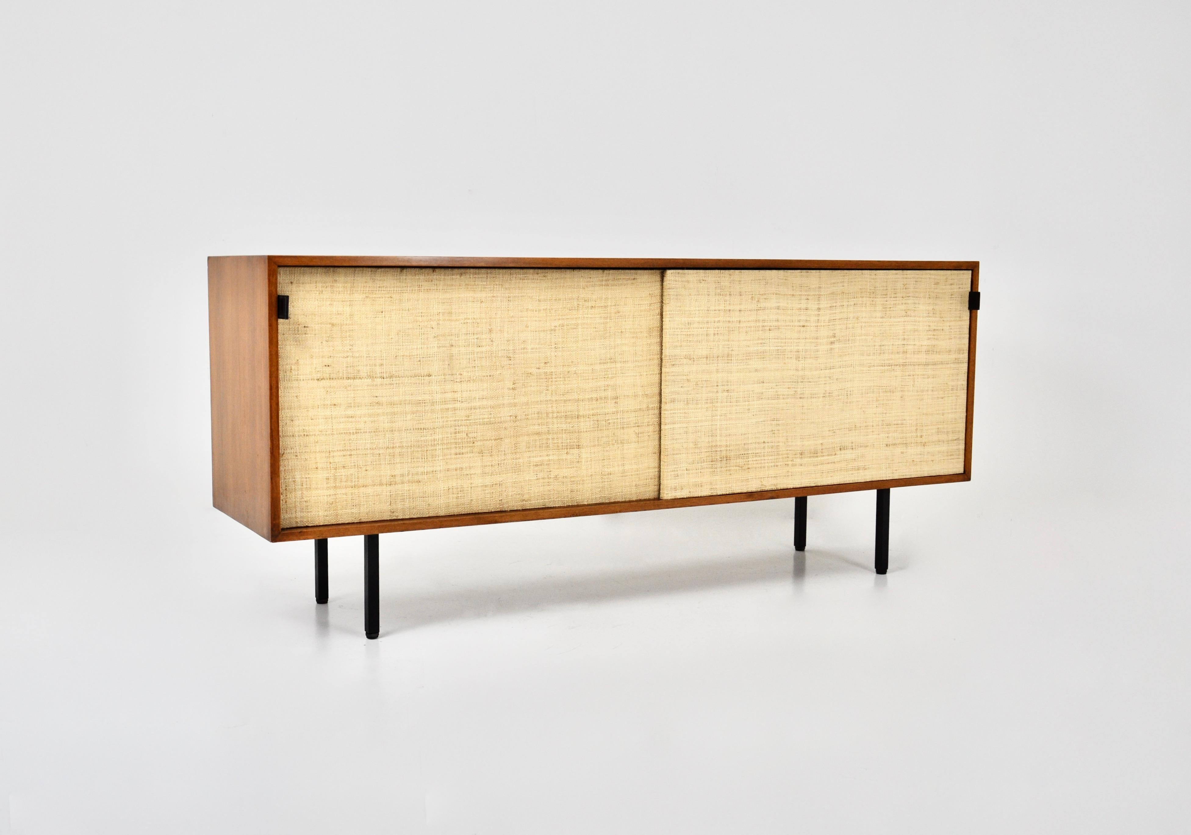 Sideboard with two sliding doors upholstered in elm wood cord with leather handles. Adjustable intermediate boards. Wear due to time and age of the sideboard.