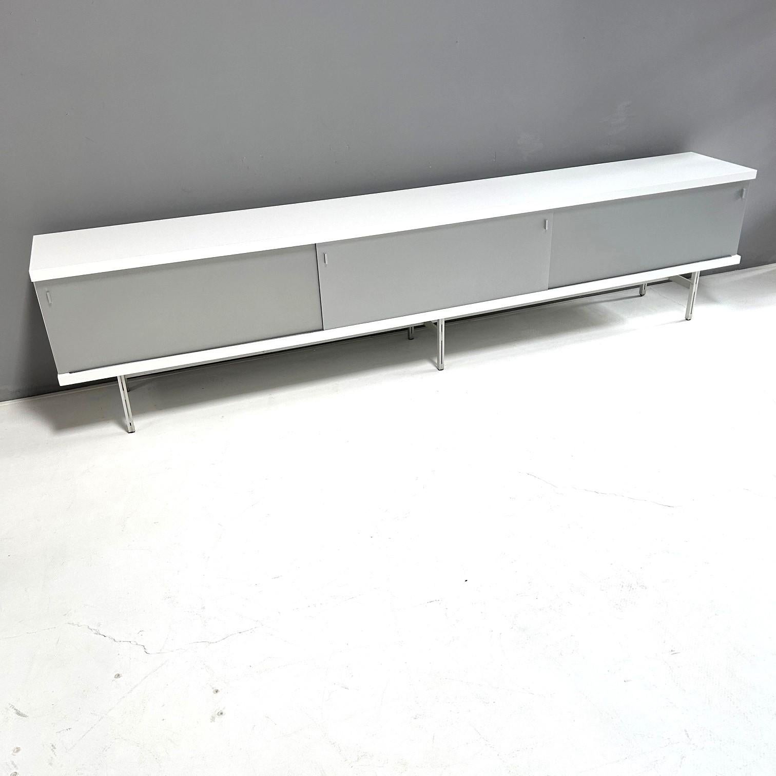 Sideboard model 1730 by Horst Brüning for Behr Production KG, Wendlingen.

Sliding doors and base frame made of aluminum.
Equipped with an integrated strip on the back for wall mounting, if the sideboard was to be placed without the
