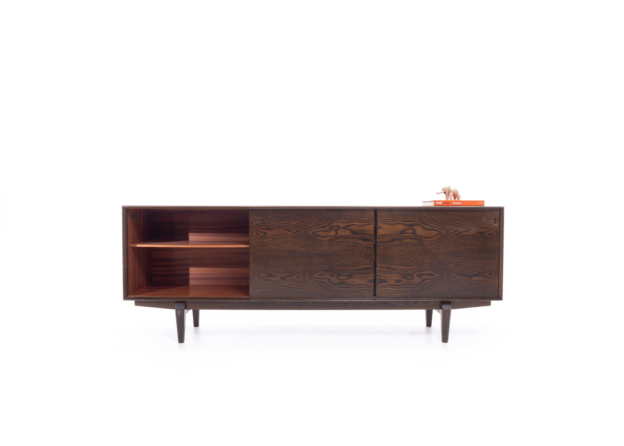 Transform your dining room or living space into a sophisticated oasis with this Mid-Century Modern Sideboard by Egon Kristensen for Skovby Møbelfabrik. This timeless classic boasts an elegant and minimalist design that's sure to impress your